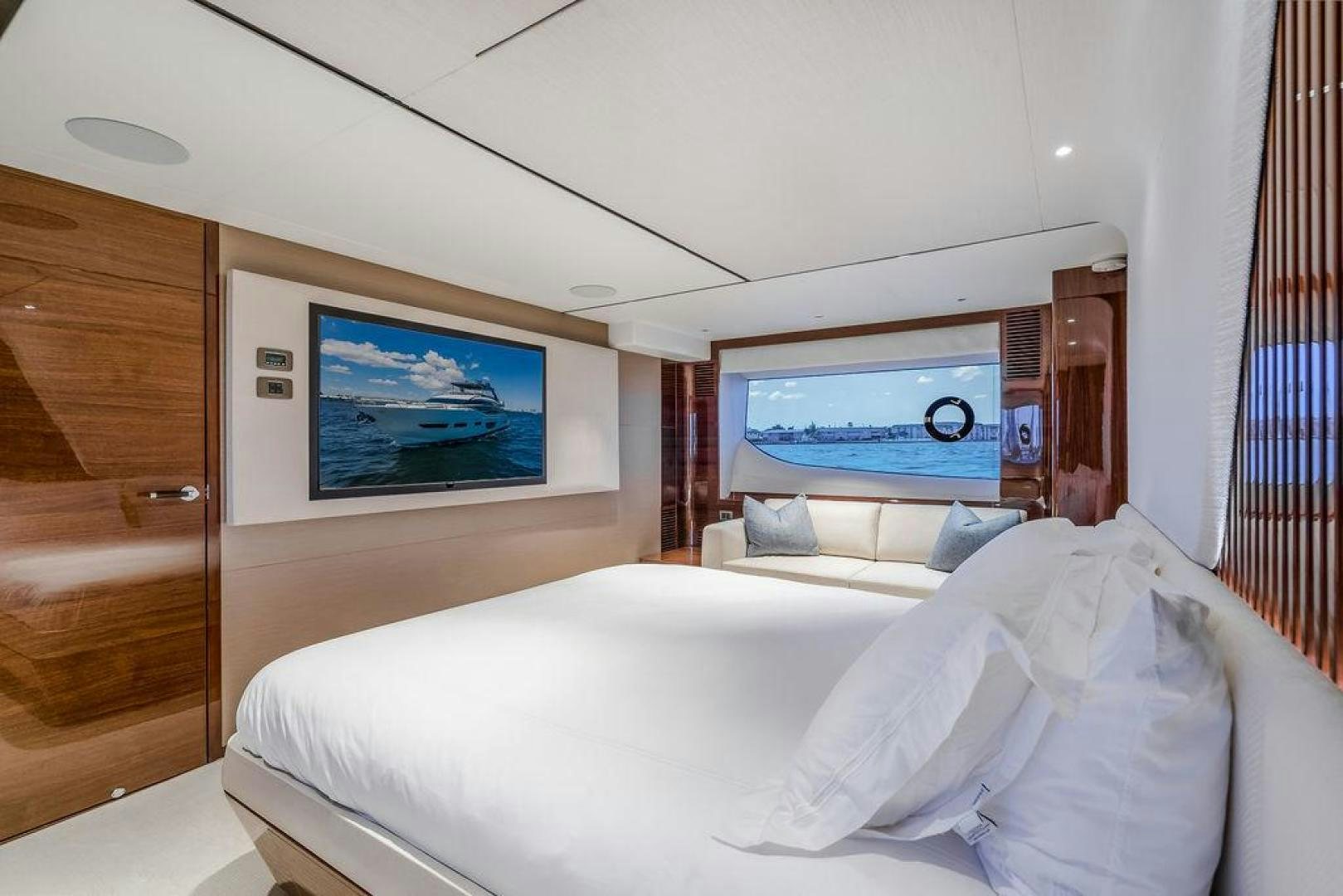 a room with a bed and a television aboard HIDEOUT Yacht for Sale