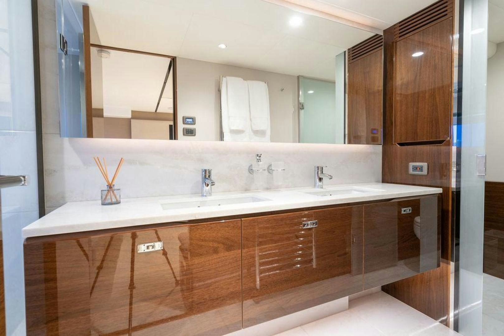 a bathroom with a large mirror aboard HIDEOUT Yacht for Sale