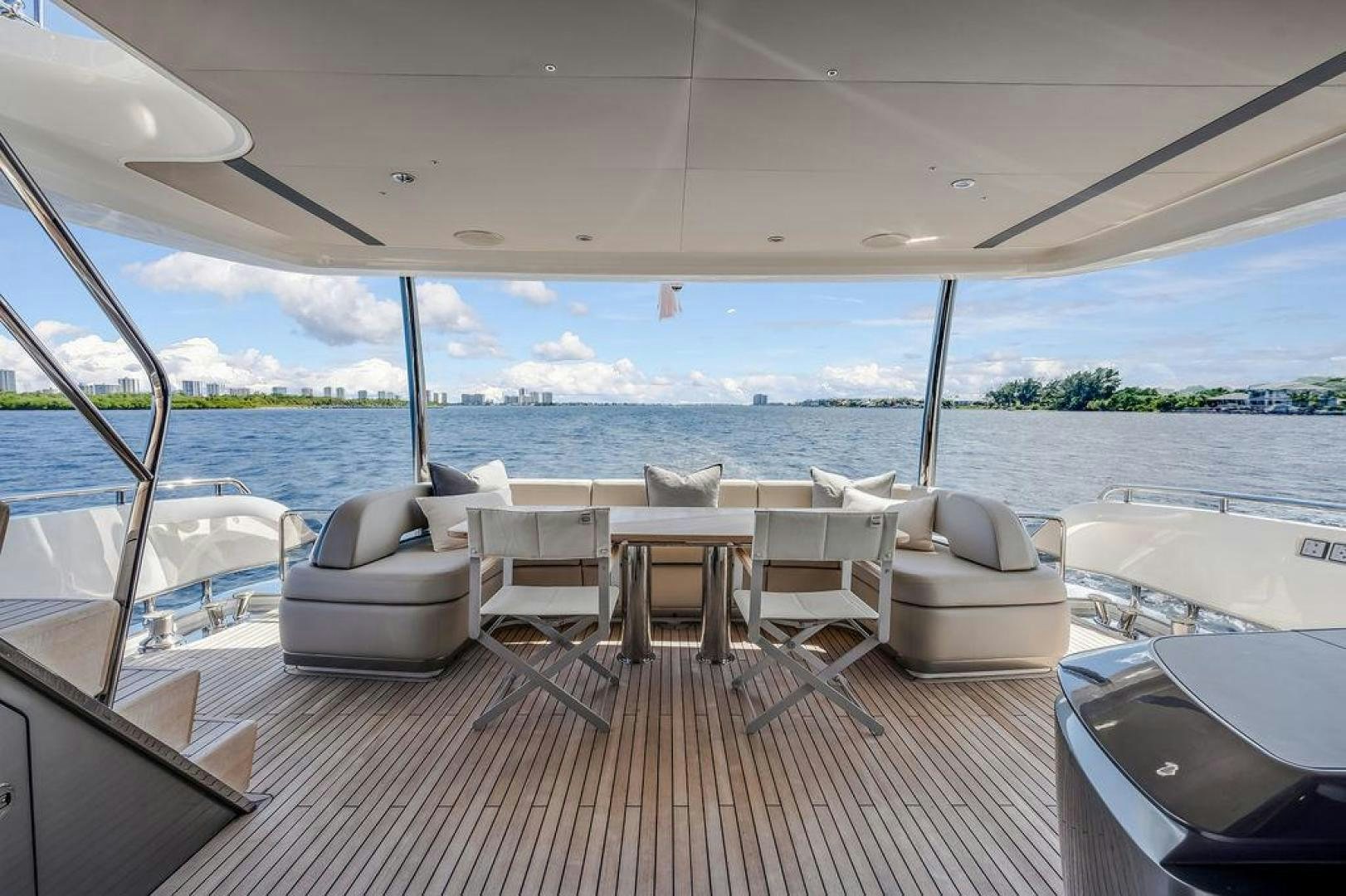 a room with a view of the water and a large city aboard HIDEOUT Yacht for Sale