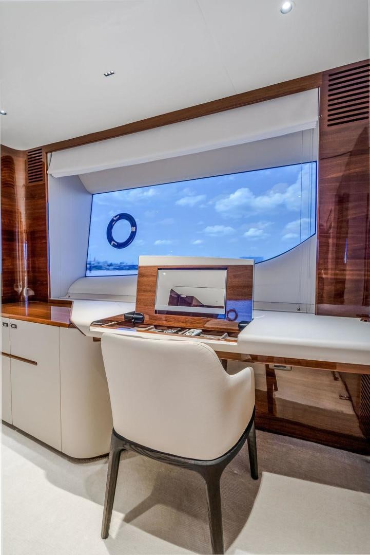 a room with a desk and a tv aboard HIDEOUT Yacht for Sale