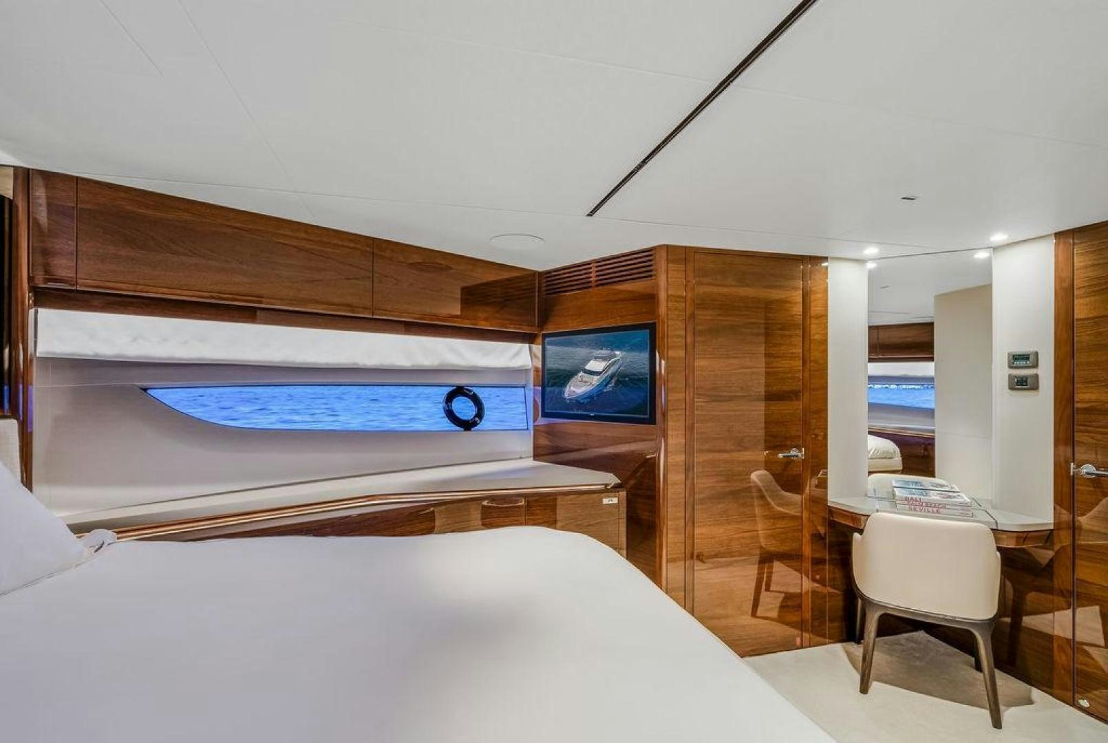 a room with a bed and a television aboard HIDEOUT Yacht for Sale
