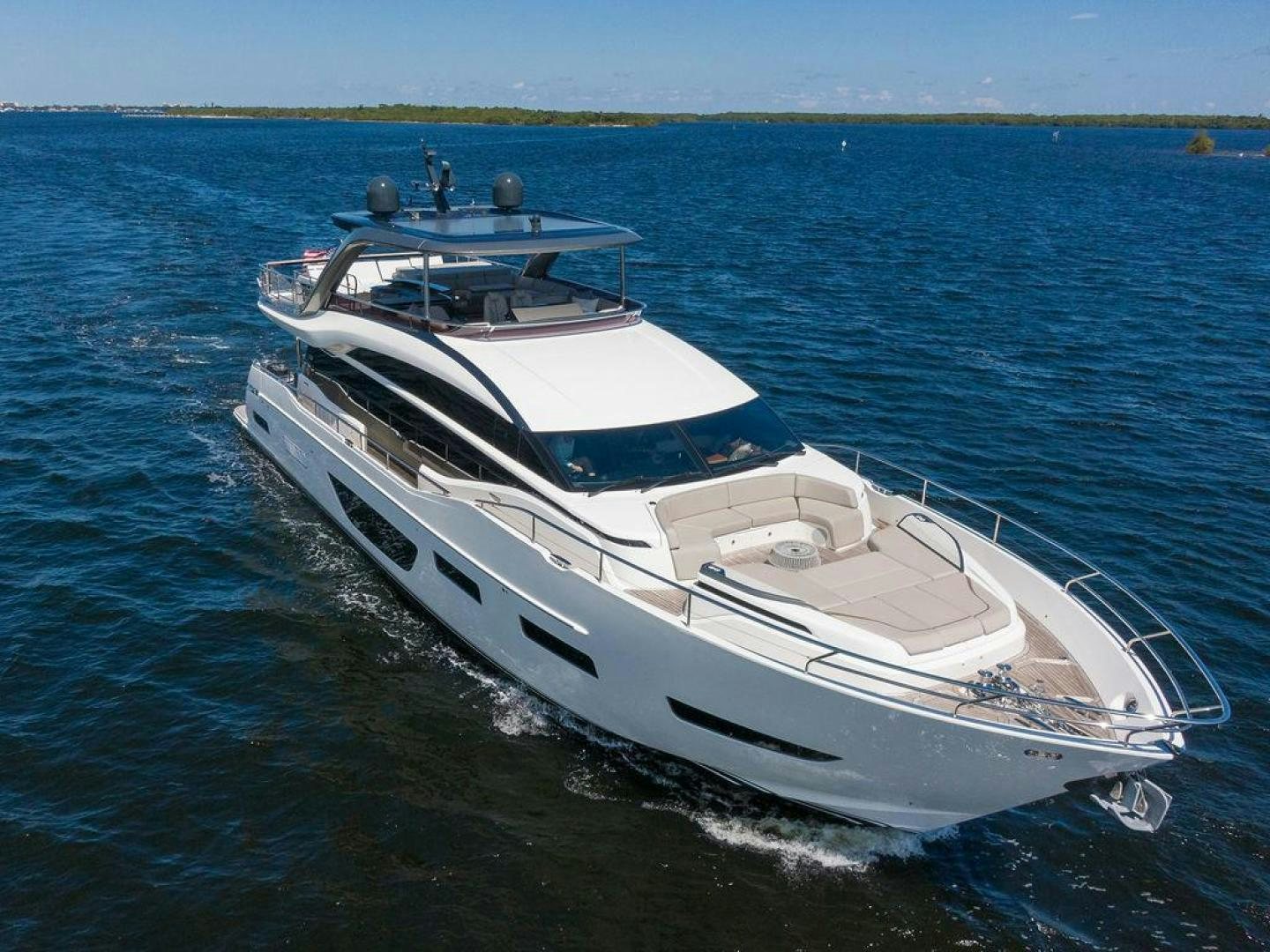 a white yacht on the water aboard HIDEOUT Yacht for Sale