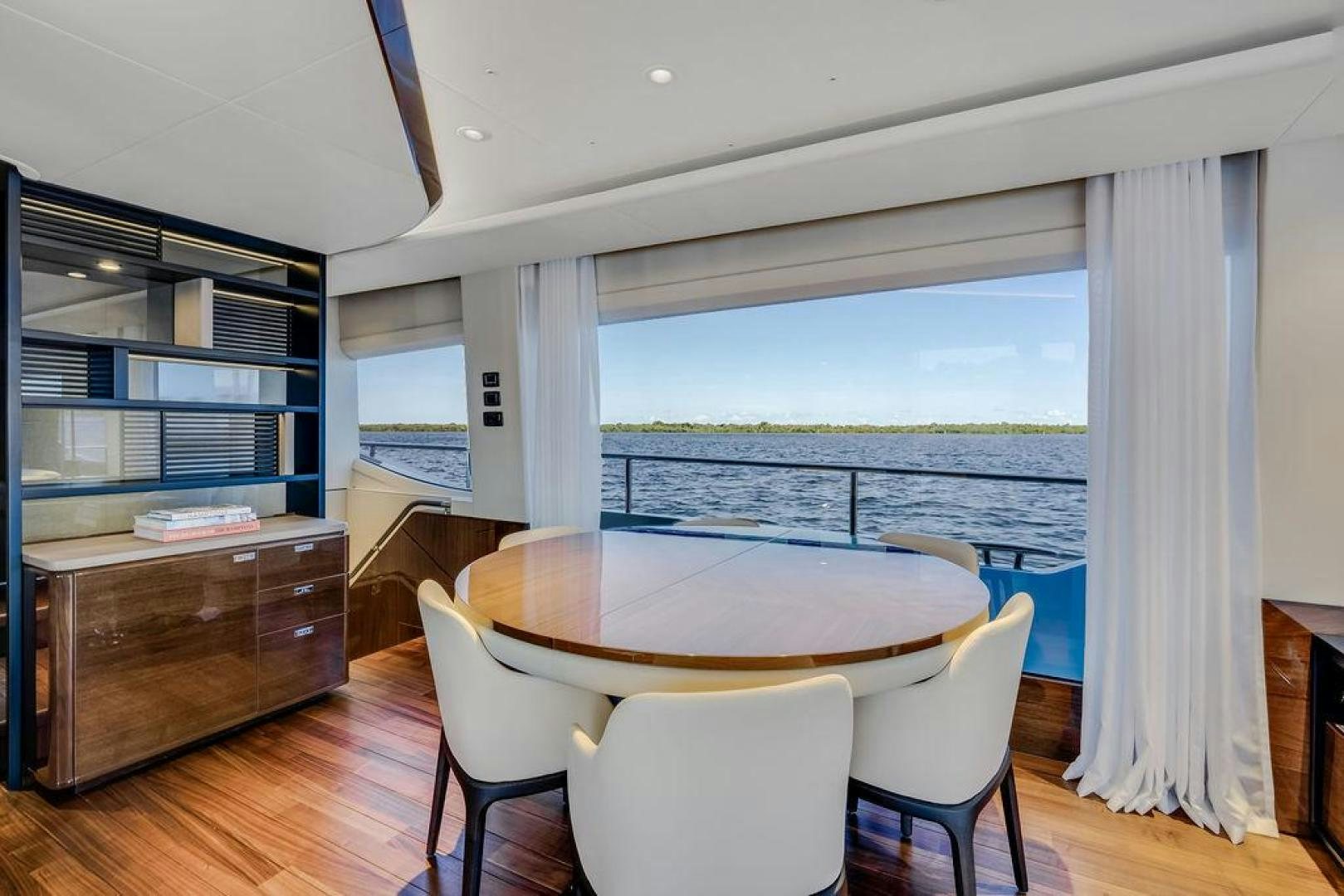 a room with a table and chairs aboard HIDEOUT Yacht for Sale