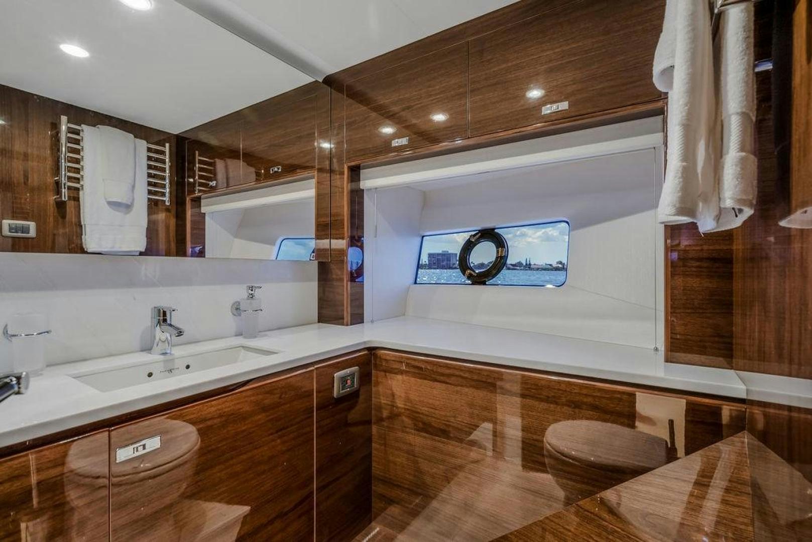 a bathroom with a large mirror aboard HIDEOUT Yacht for Sale