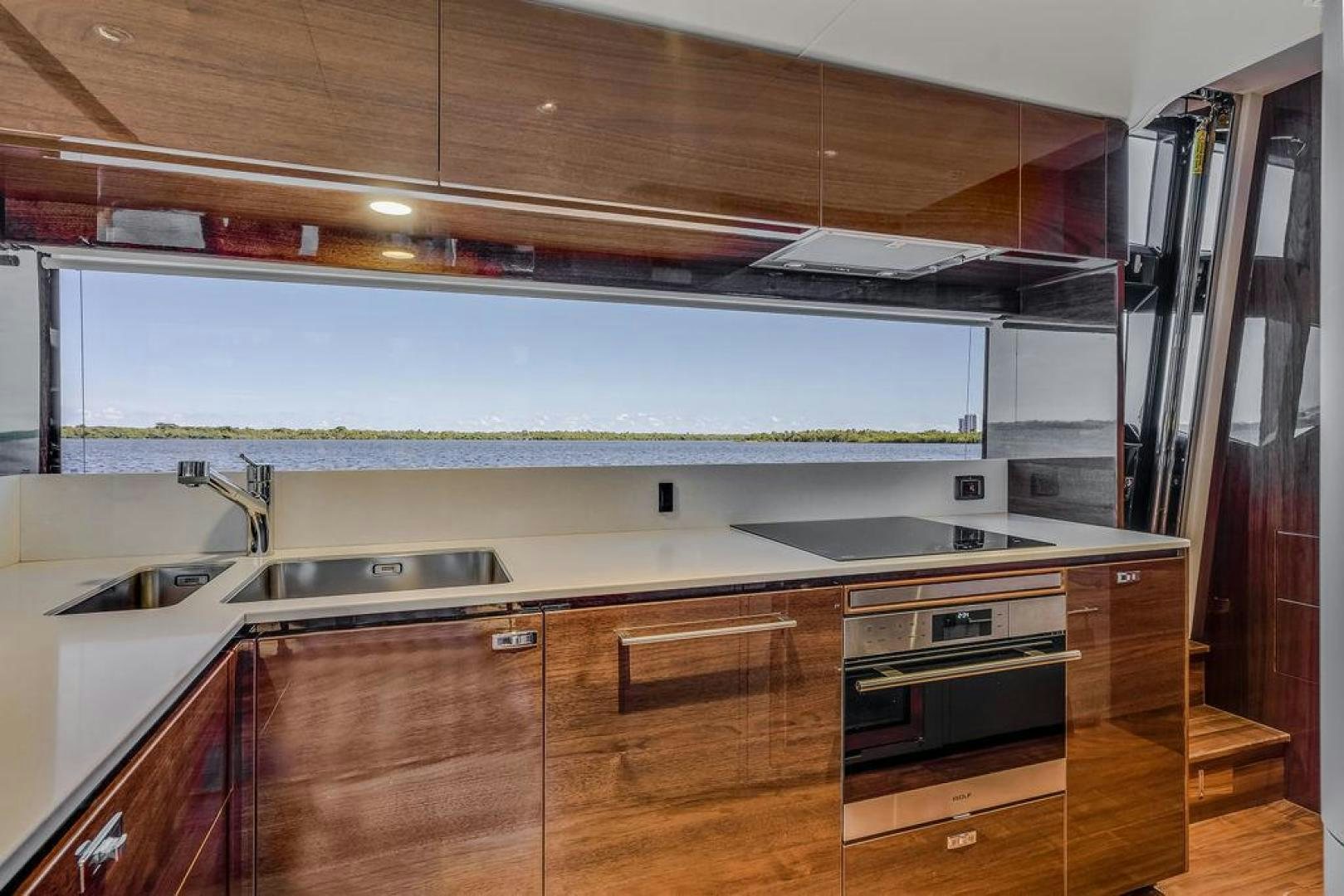 a kitchen with wooden cabinets aboard HIDEOUT Yacht for Sale