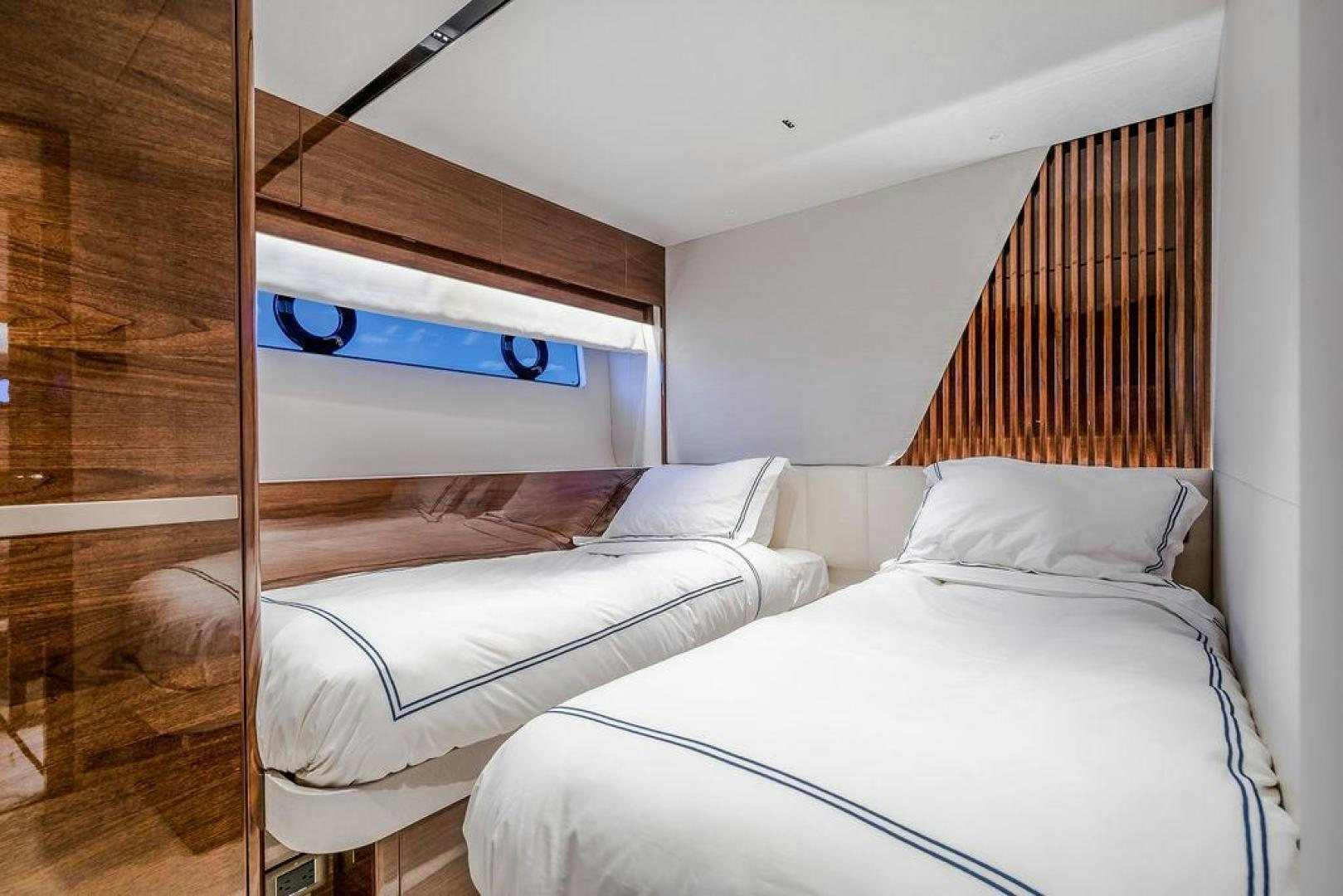 a couple of beds in a room aboard HIDEOUT Yacht for Sale