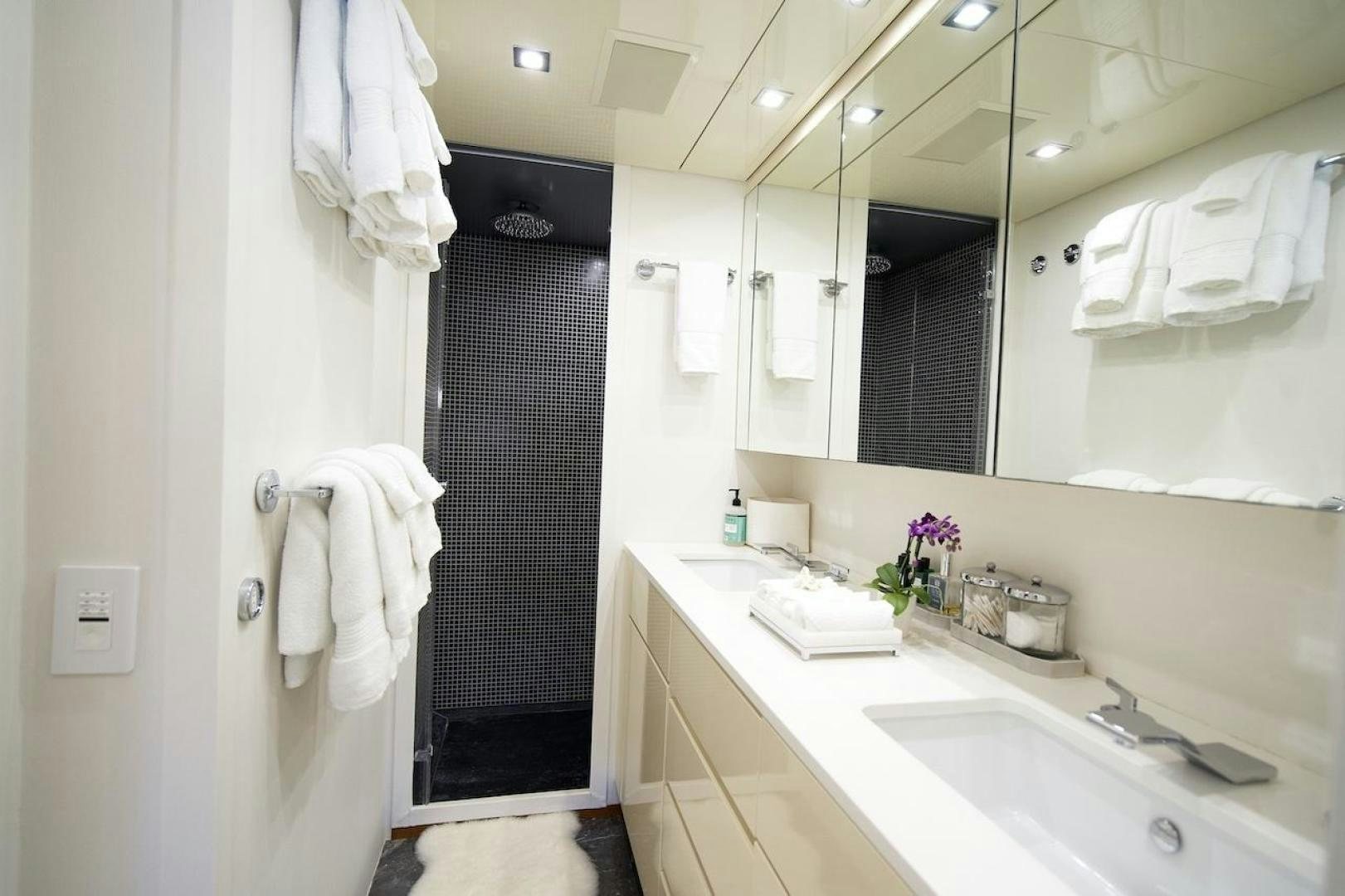 a bathroom with a sink and a mirror aboard U WISH Yacht for Sale