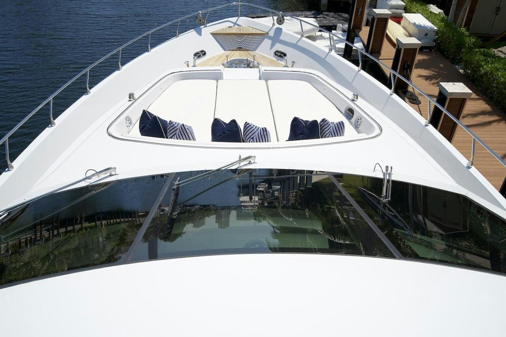 a white boat with a deck and a deck and a pool aboard U WISH Yacht for Sale