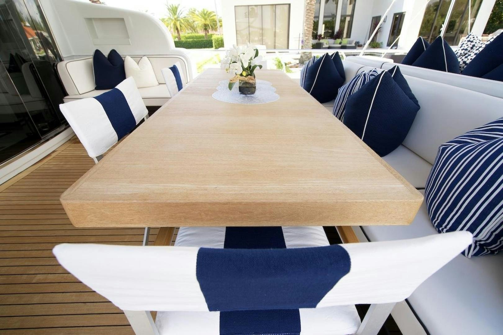 a table with chairs around it aboard U WISH Yacht for Sale