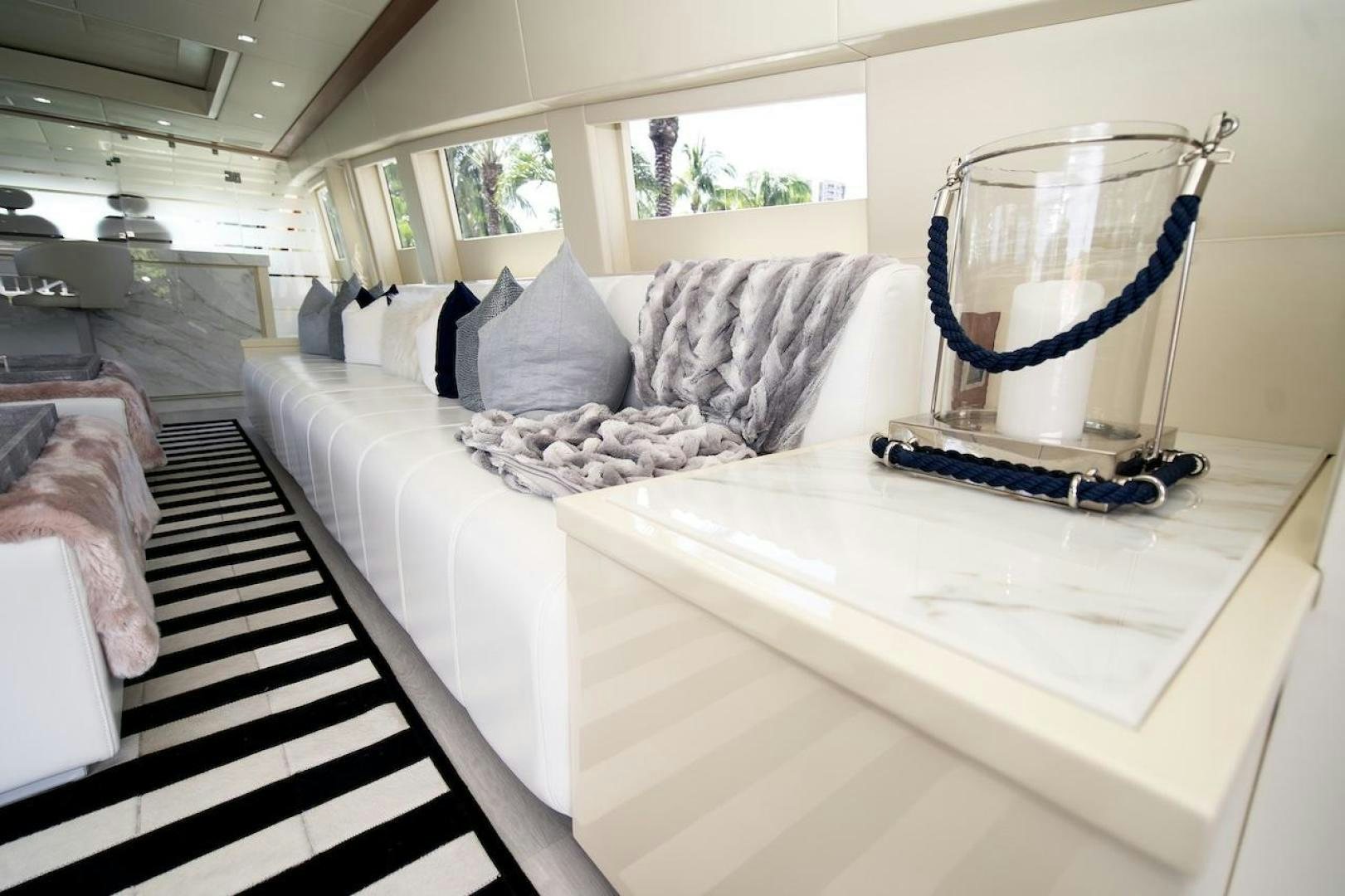 a white couch in a room aboard U WISH Yacht for Sale