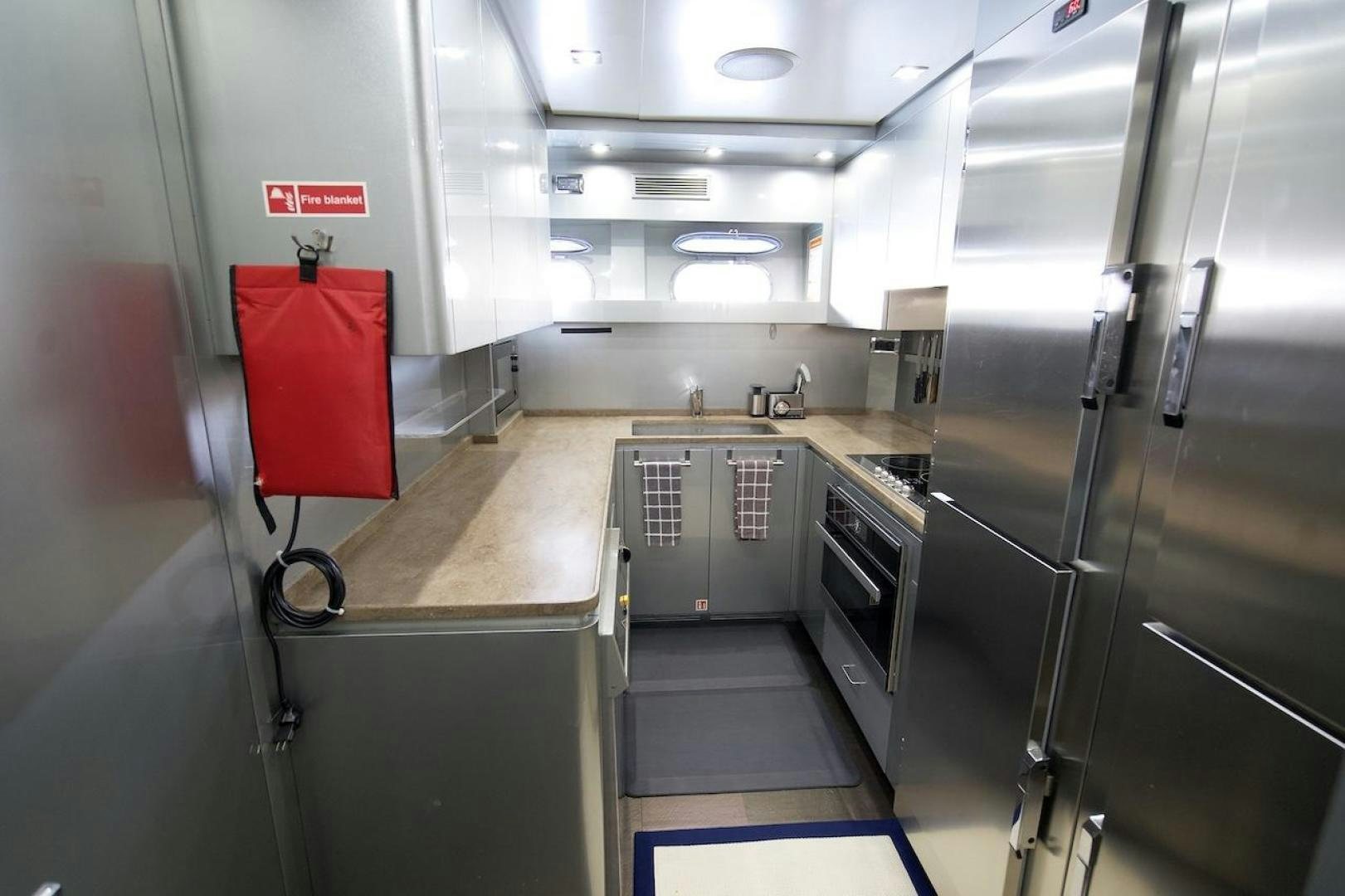 a kitchen with stainless steel appliances aboard U WISH Yacht for Sale