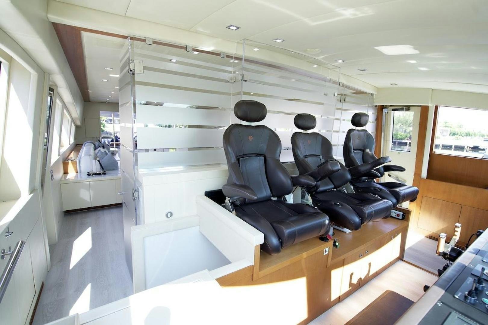 a room with chairs and a table aboard U WISH Yacht for Sale