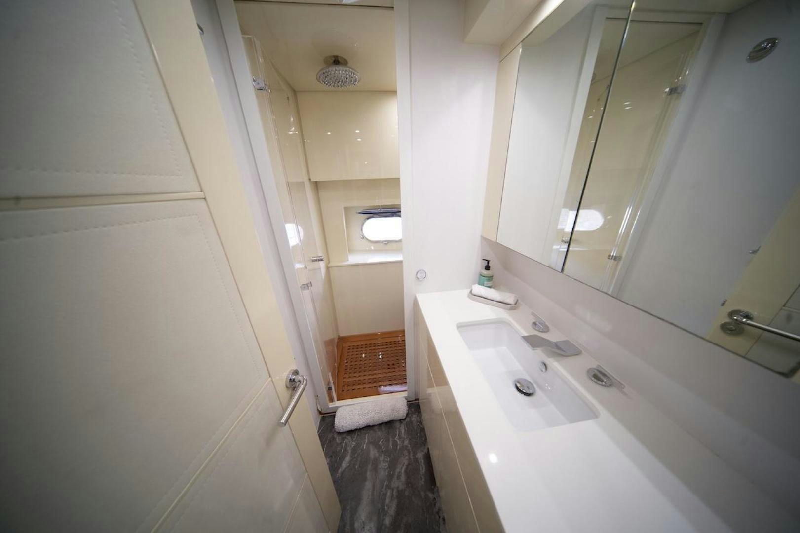 a bathroom with a large mirror aboard U WISH Yacht for Sale