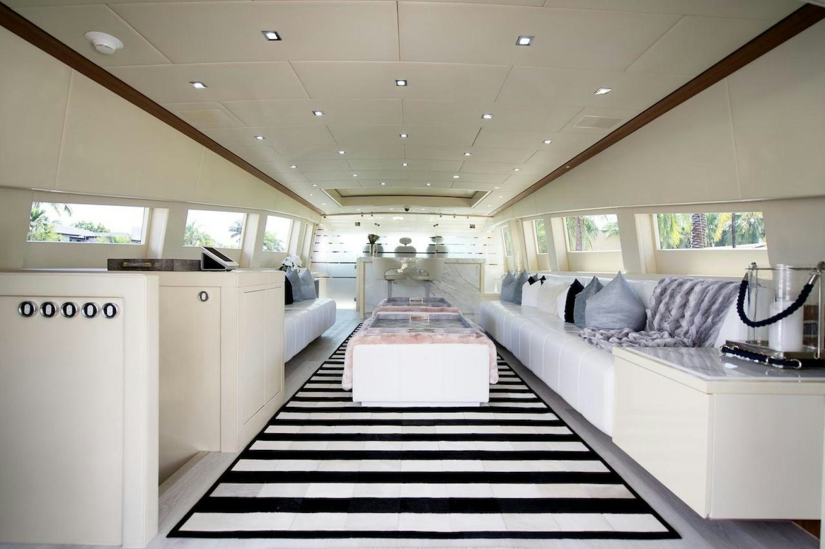 a large room with a black and white striped rug aboard U WISH Yacht for Sale