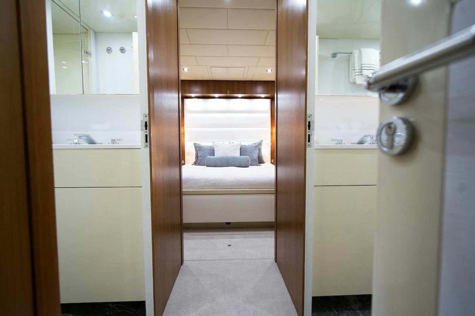 a room with a bed and a closet aboard U WISH Yacht for Sale