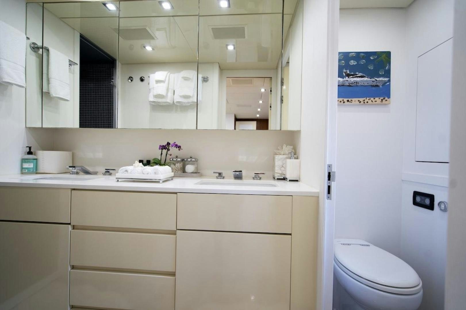 a bathroom with a toilet and a sink aboard U WISH Yacht for Sale