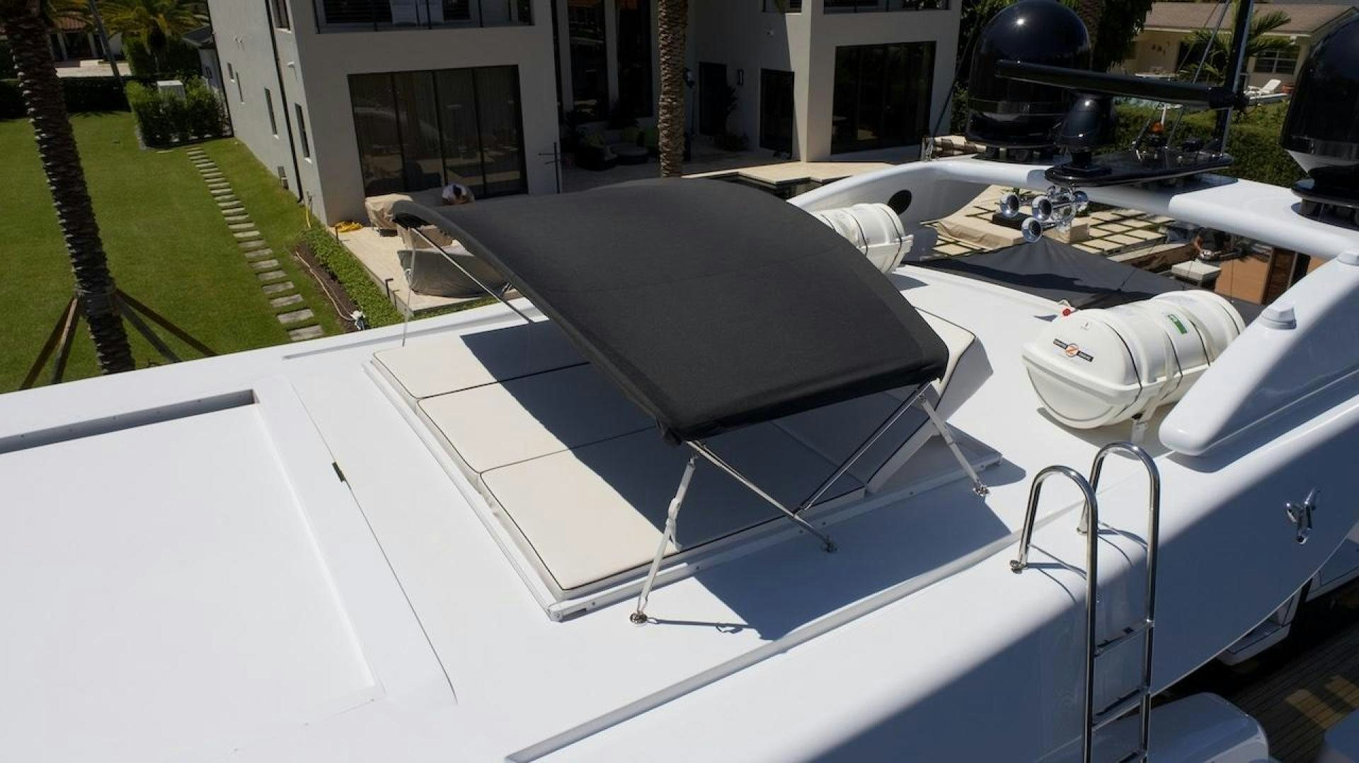 a white car with a black roof aboard U WISH Yacht for Sale