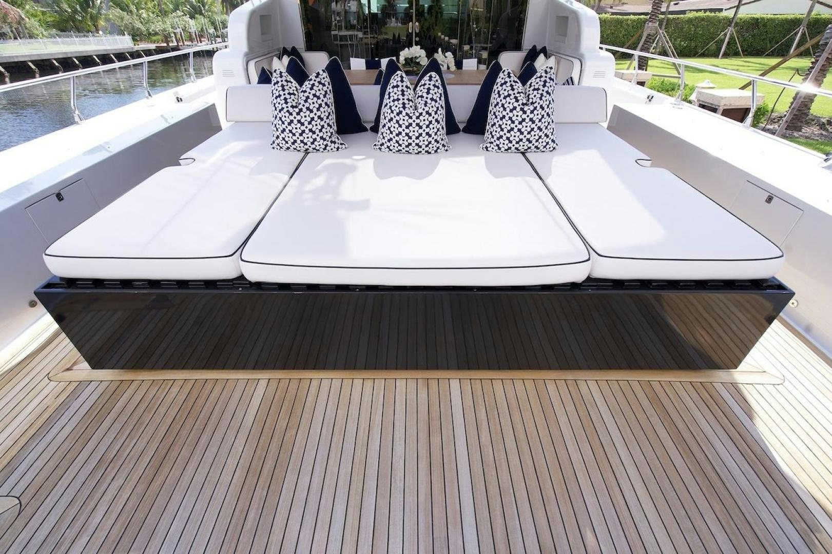 a group of people sitting in chairs around a table aboard U WISH Yacht for Sale