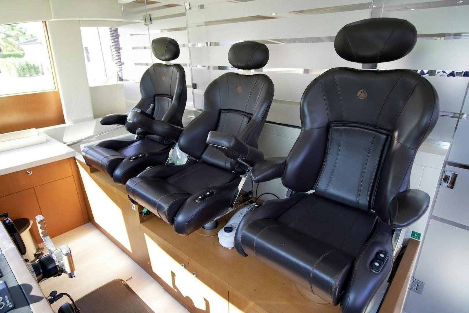 a room with chairs and a table aboard U WISH Yacht for Sale