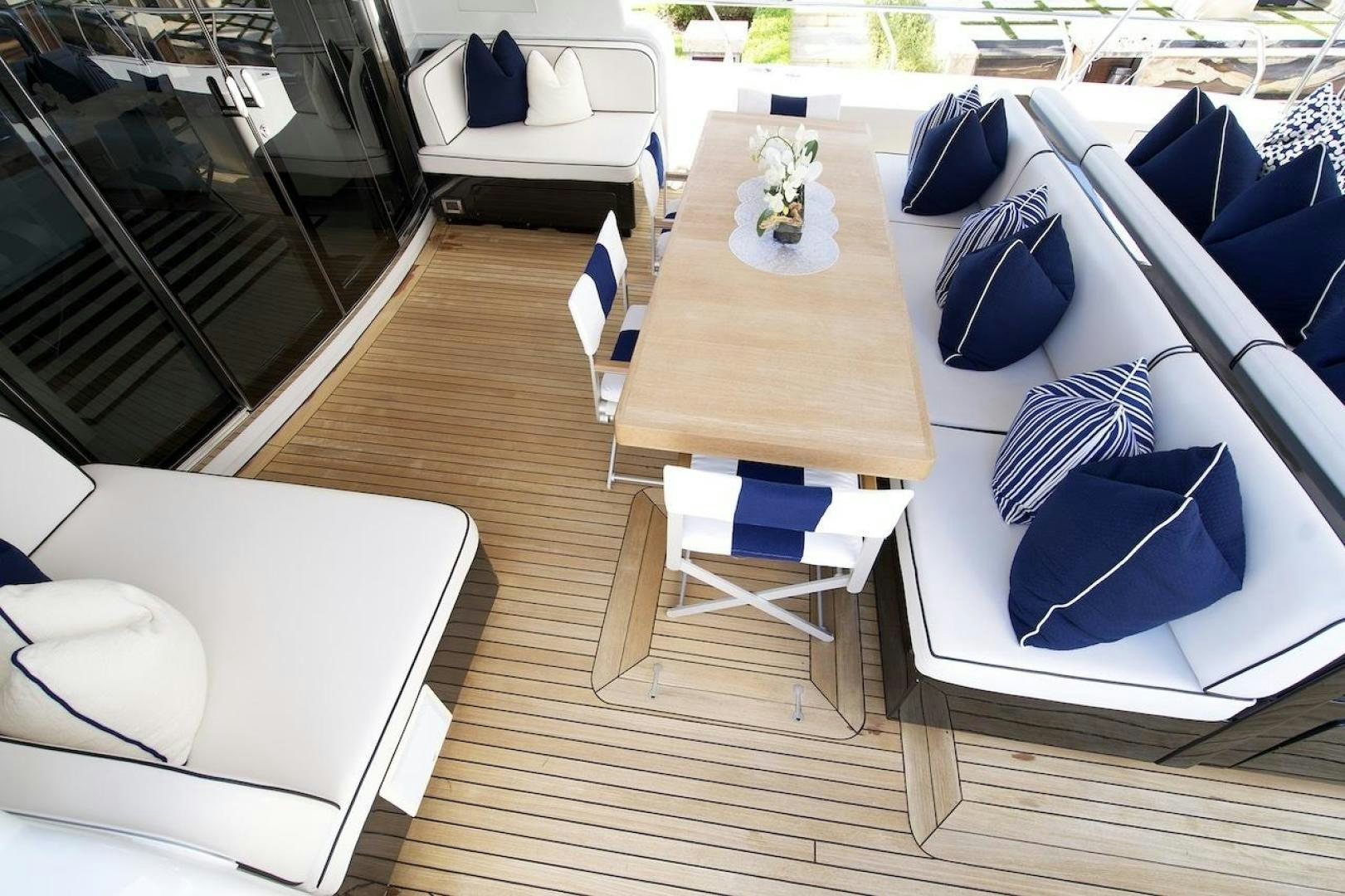 a room with a table and chairs aboard U WISH Yacht for Sale
