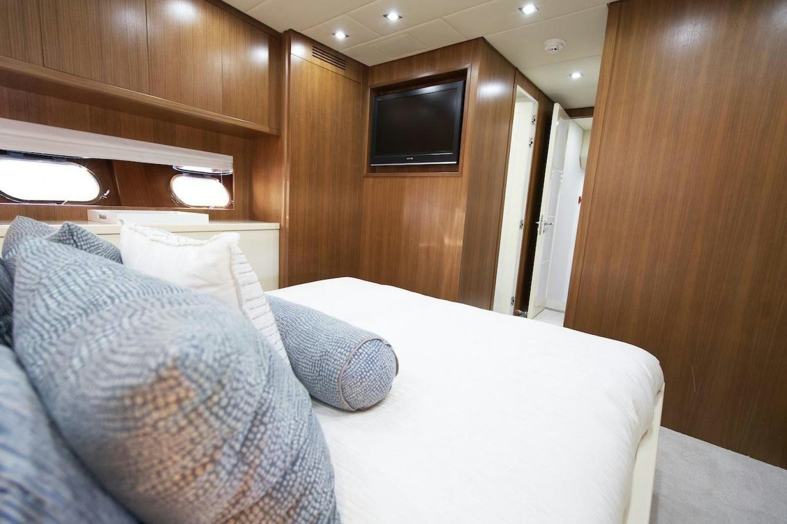 a bed with a white sheet aboard U WISH Yacht for Sale
