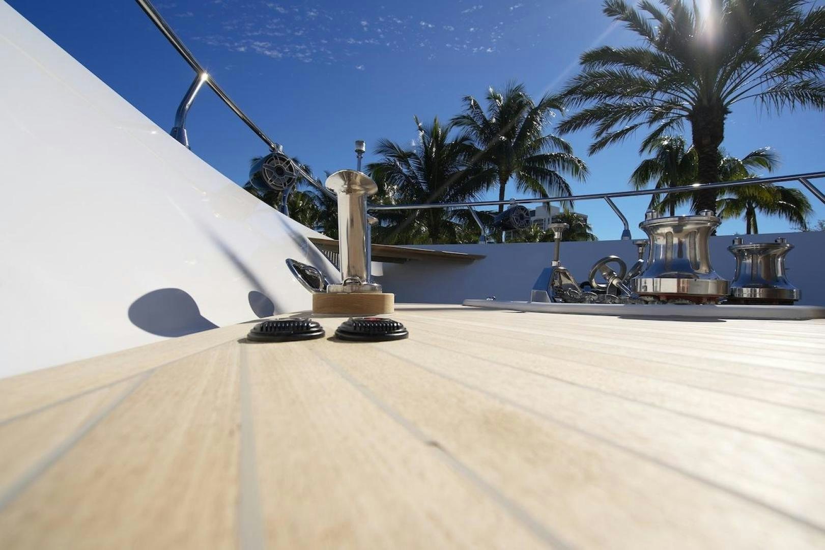 a table with a lamp and palm trees on it aboard U WISH Yacht for Sale
