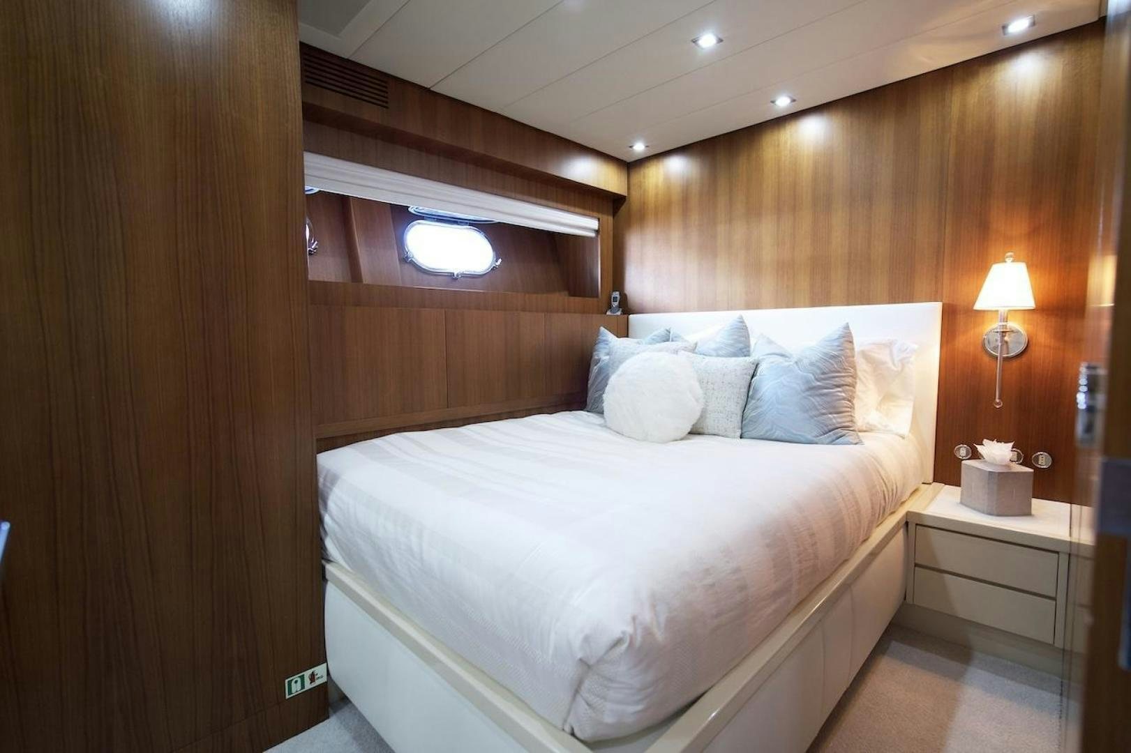 a bed with white sheets aboard U WISH Yacht for Sale