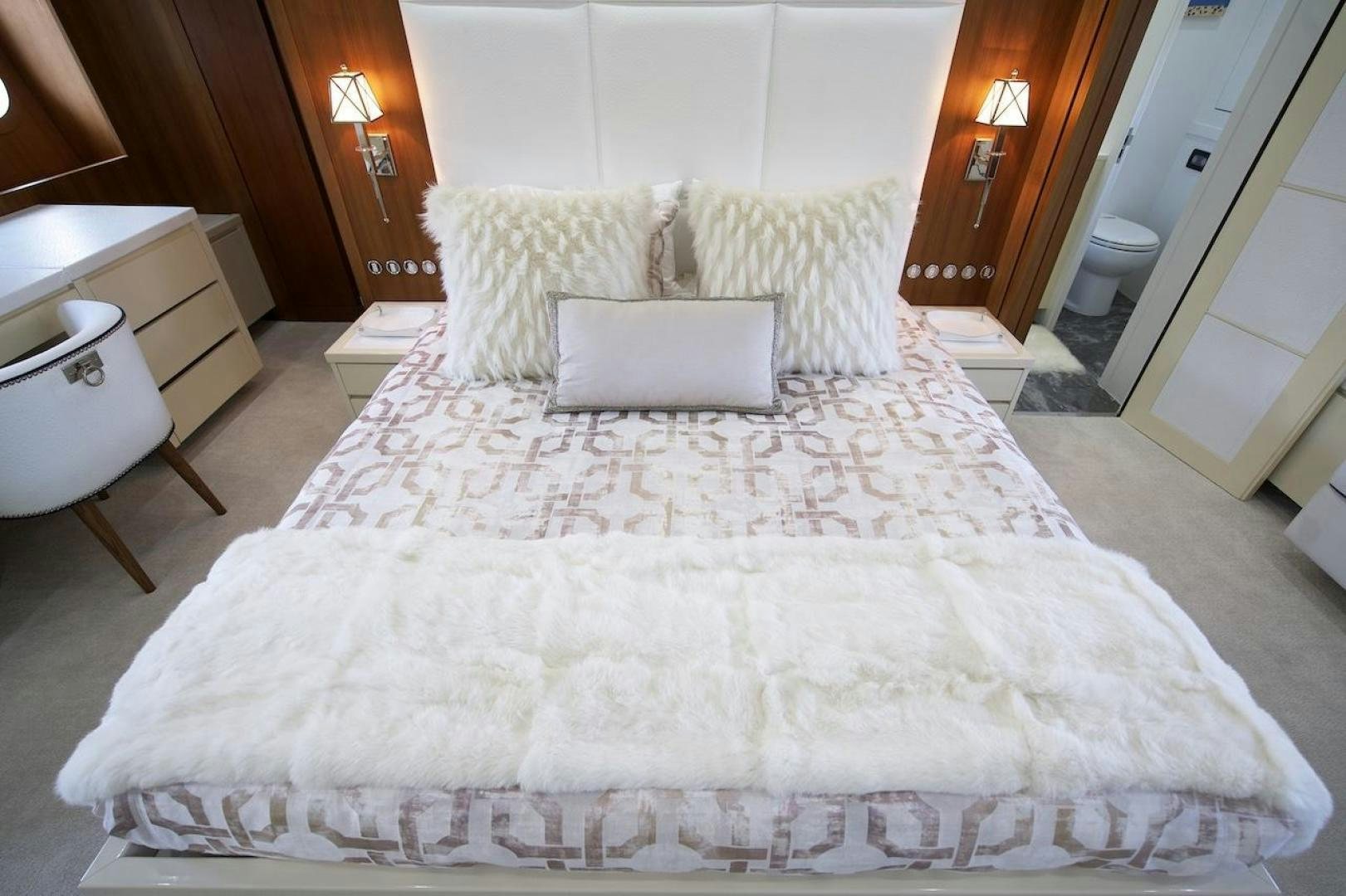 a bed with white sheets aboard U WISH Yacht for Sale