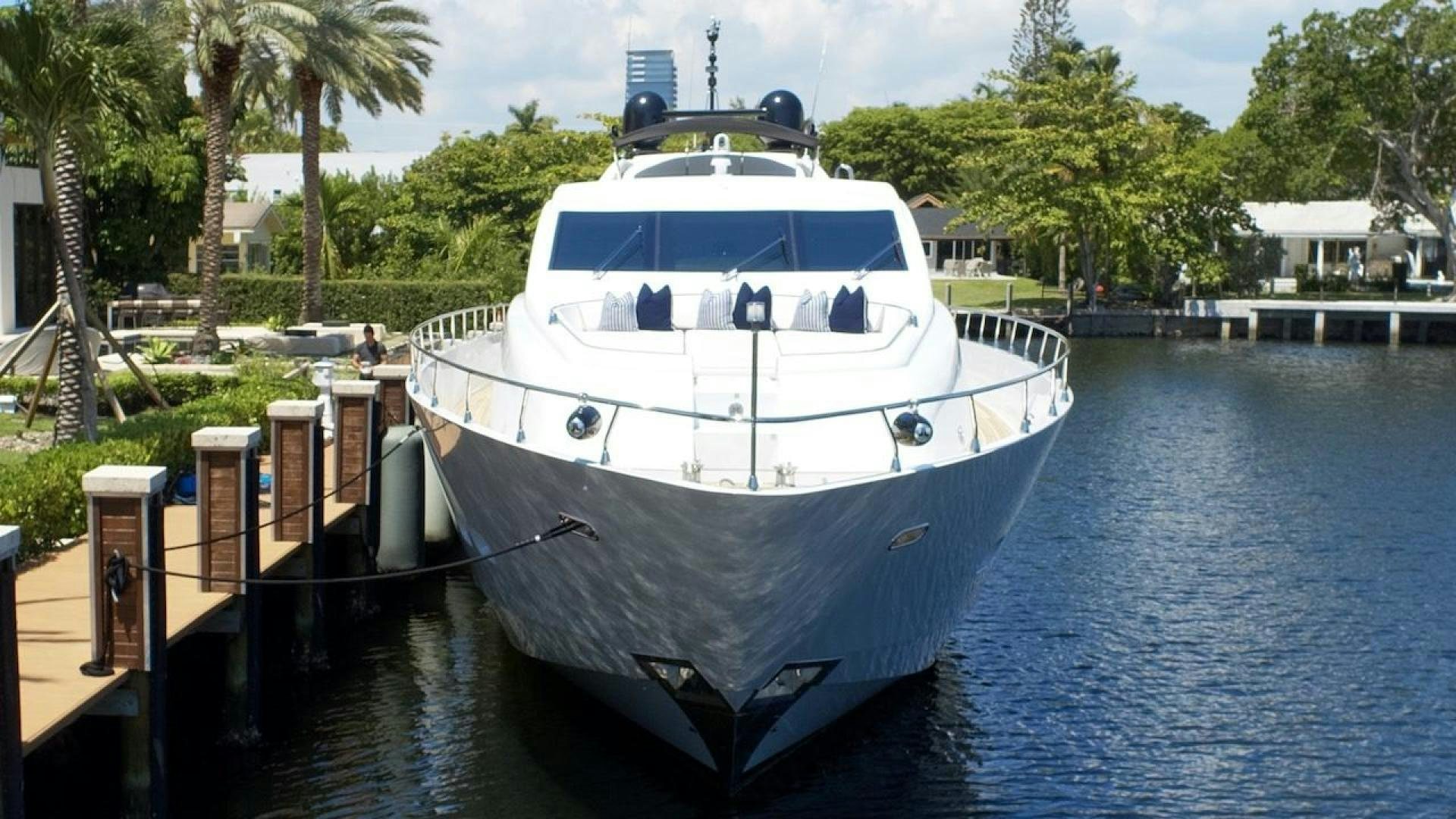 a large white boat docked aboard U WISH Yacht for Sale