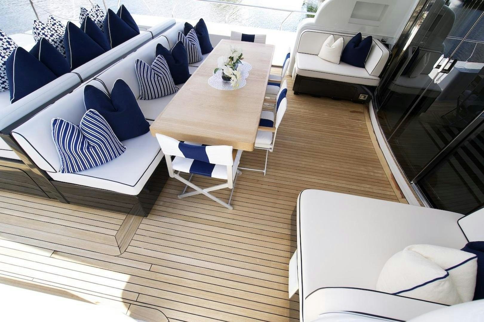 a room with a table and chairs aboard U WISH Yacht for Sale