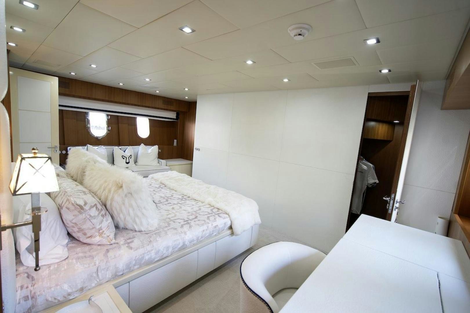 a room with a bed and a mirror aboard U WISH Yacht for Sale