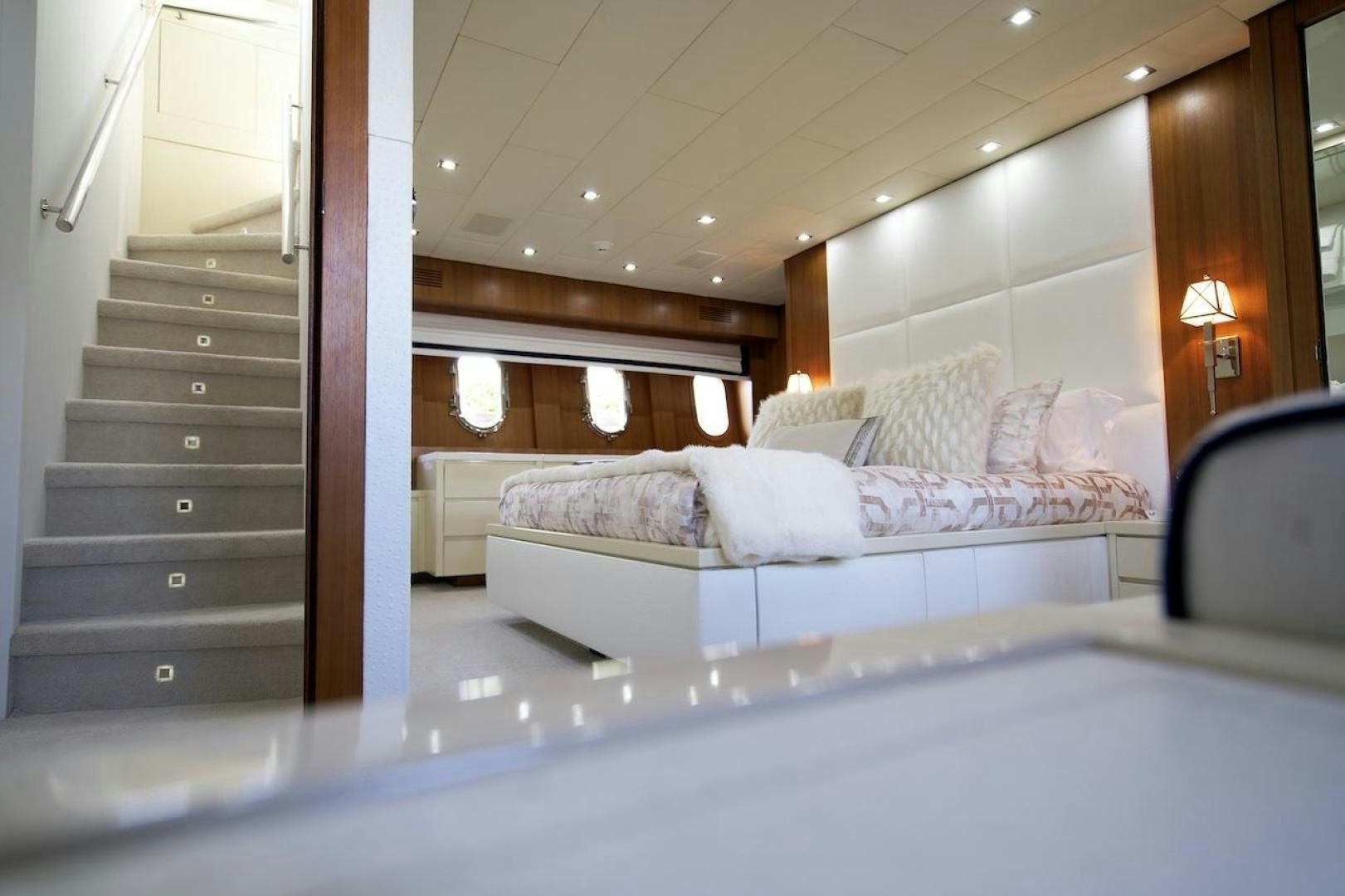 a bed with white sheets aboard U WISH Yacht for Sale
