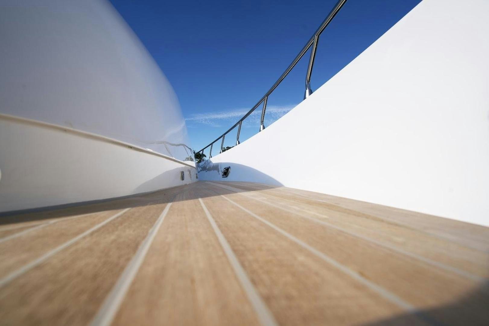 a helicopter flying over a sandy road aboard U WISH Yacht for Sale