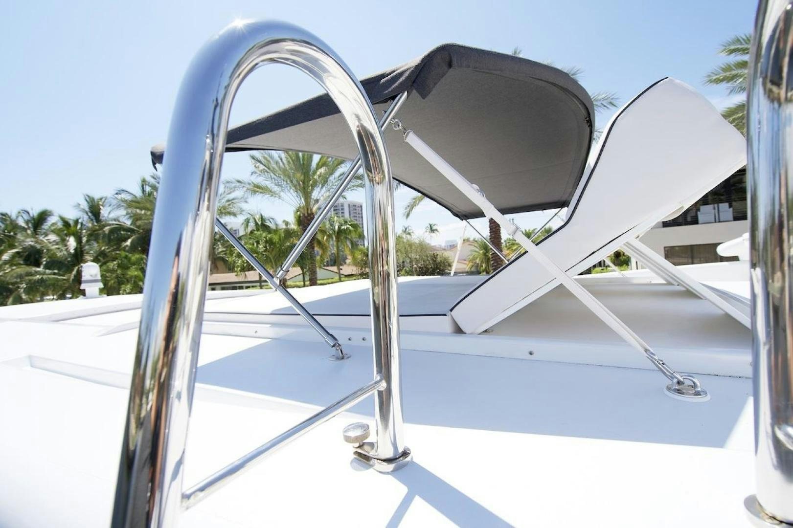 a white chair on a white surface aboard U WISH Yacht for Sale