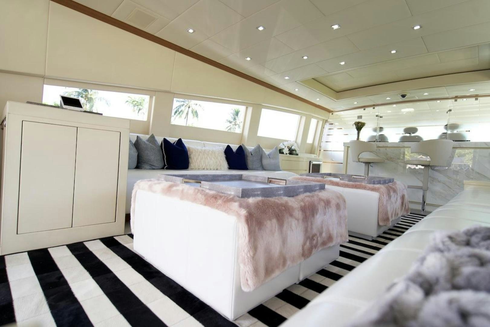 a room with a bed and a black and white checkered floor aboard U WISH Yacht for Sale