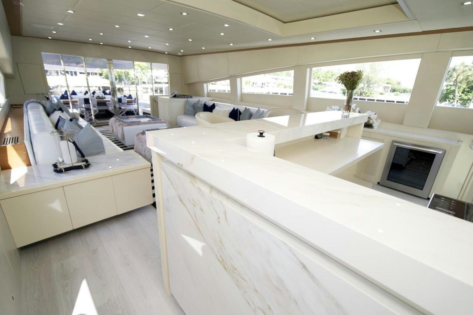 a room with white furniture aboard U WISH Yacht for Sale