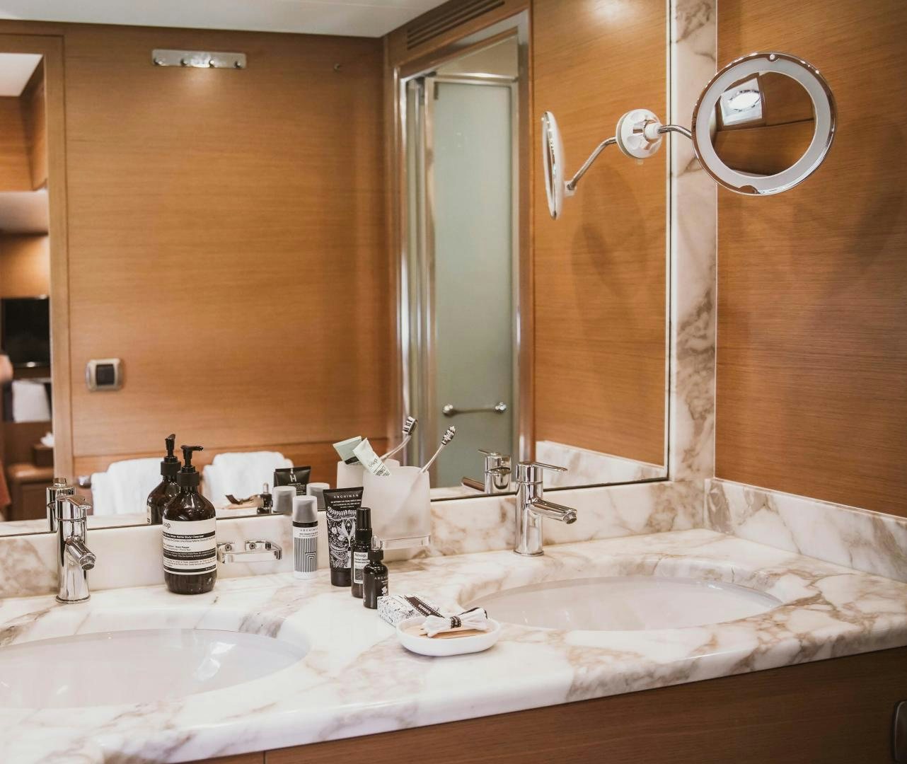a bathroom with a large mirror aboard MOKI Yacht for Sale