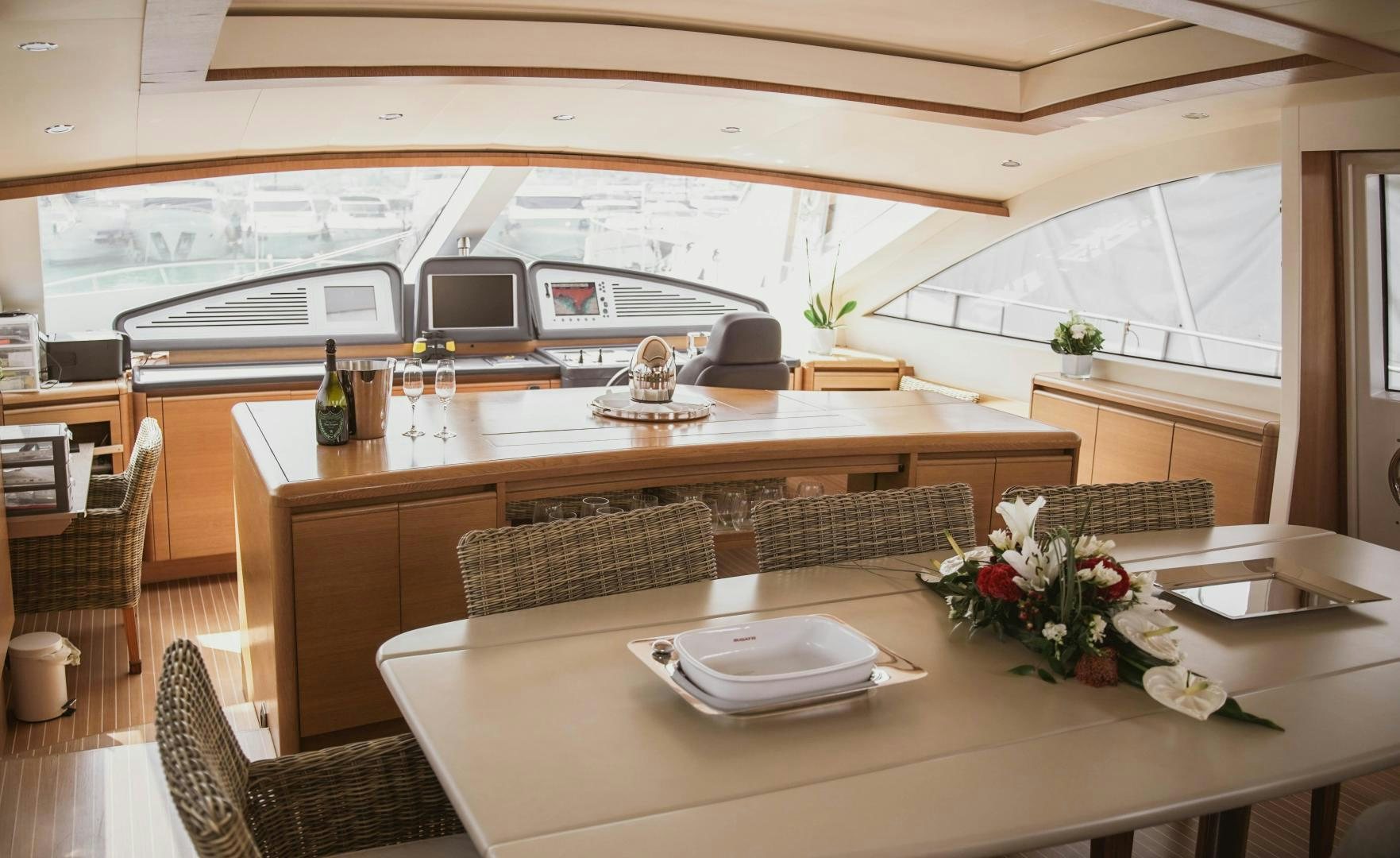 a table with plates and cups on it aboard MOKI Yacht for Sale