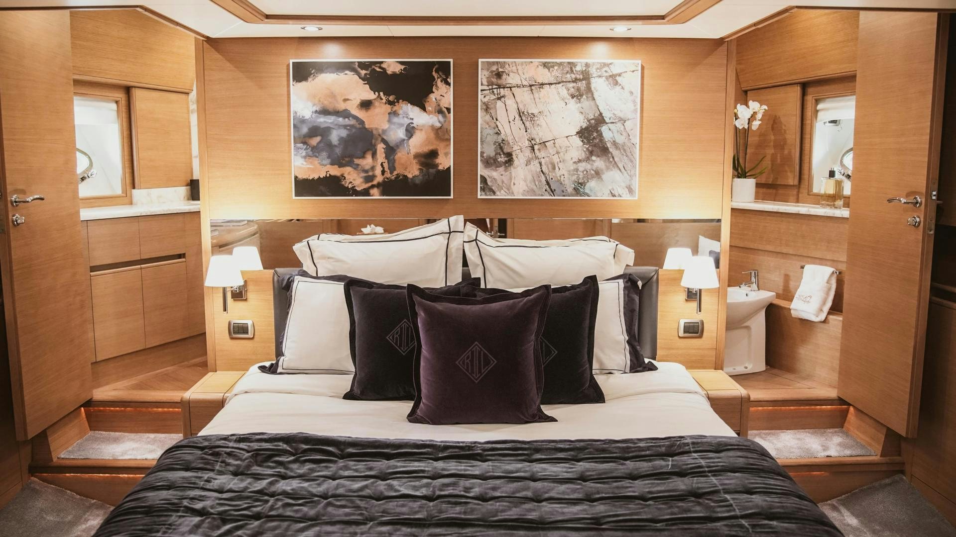 a bed with pillows aboard MOKI Yacht for Sale