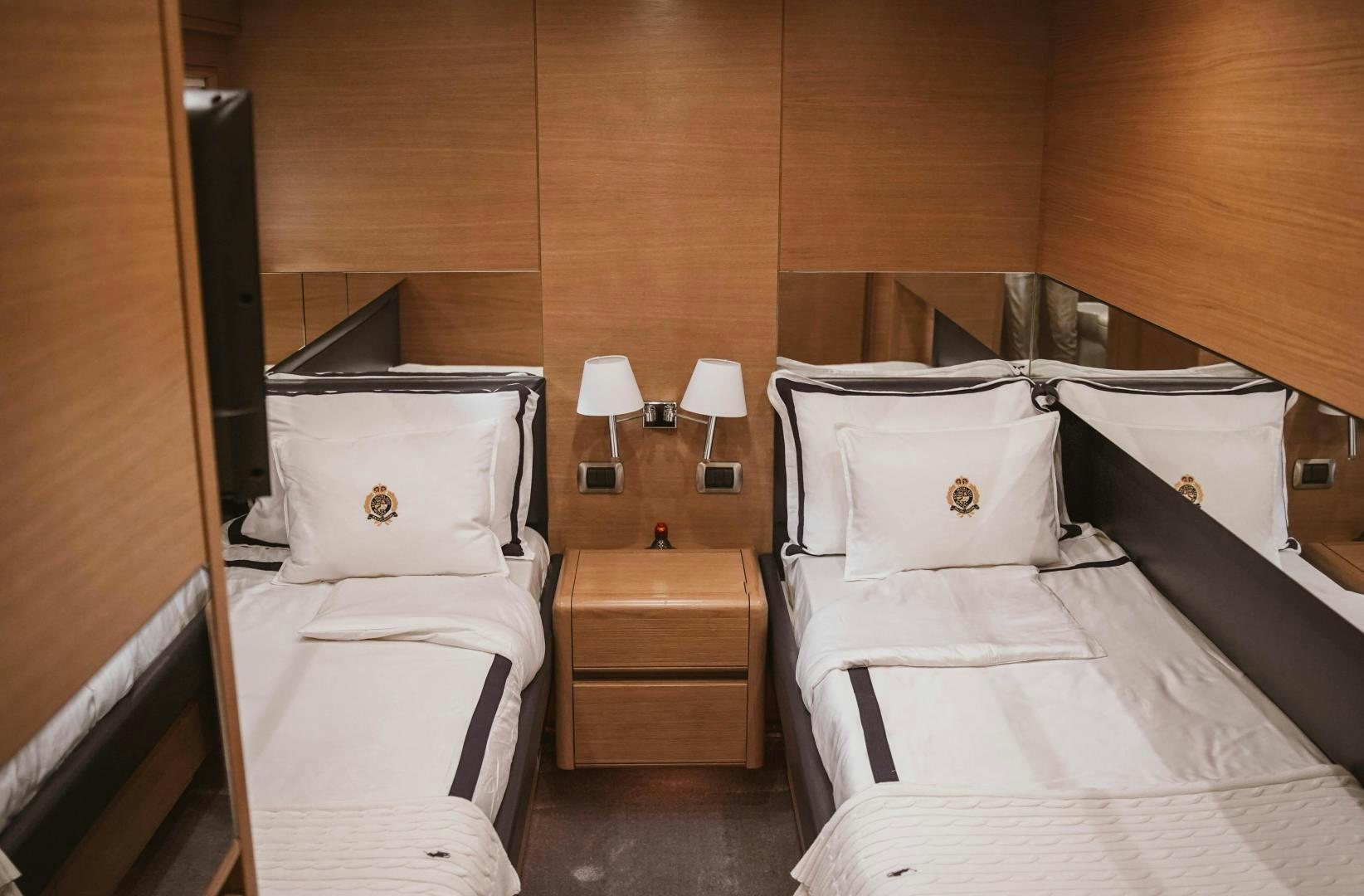 a room with two beds aboard MOKI Yacht for Sale
