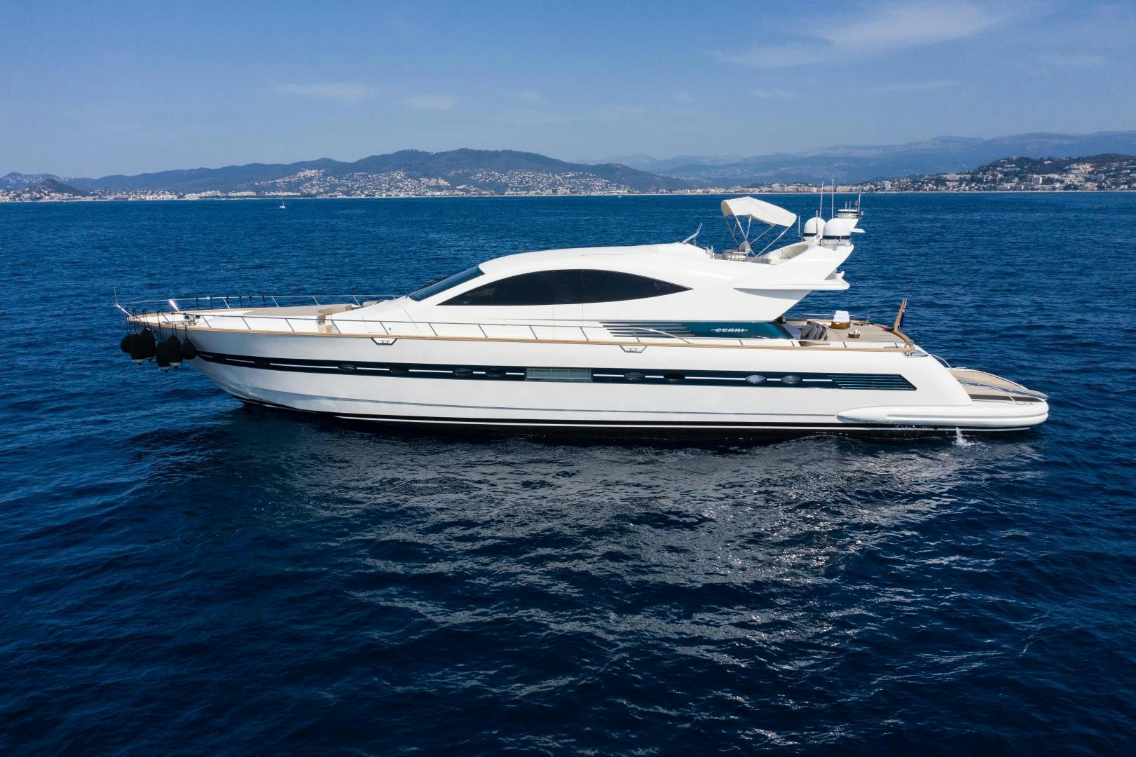 a white yacht in the water aboard MOKI Yacht for Sale