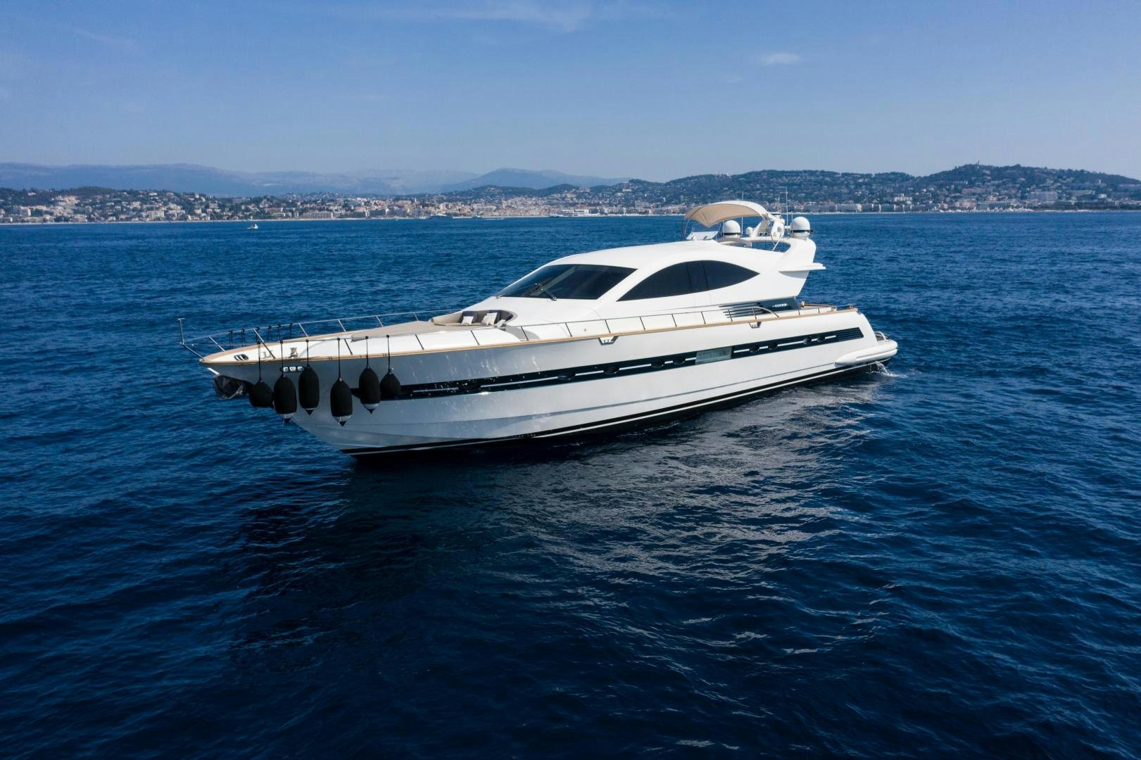 a white yacht in the water aboard MOKI Yacht for Sale