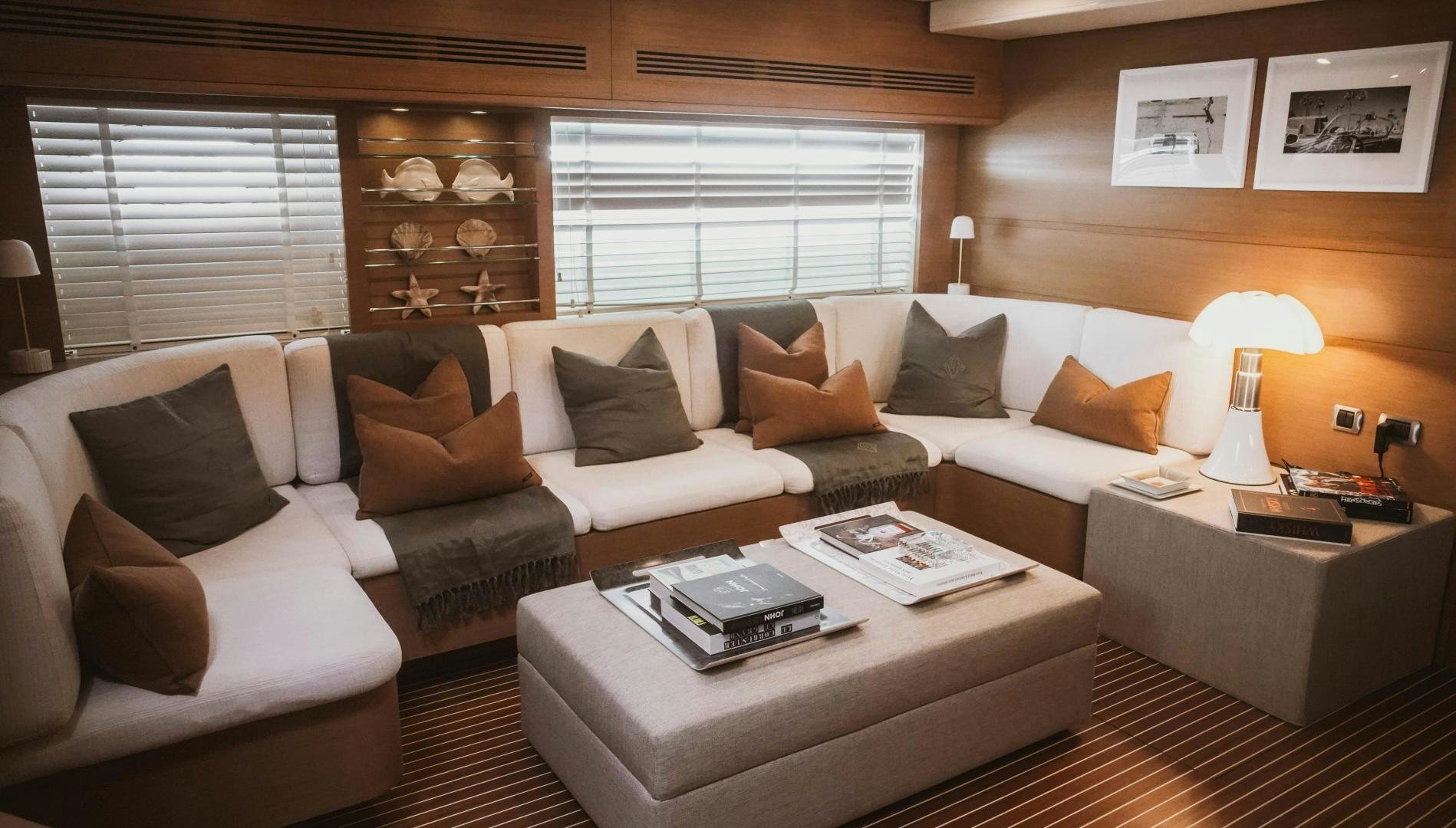 a living room with a couch and a coffee table aboard MOKI Yacht for Sale