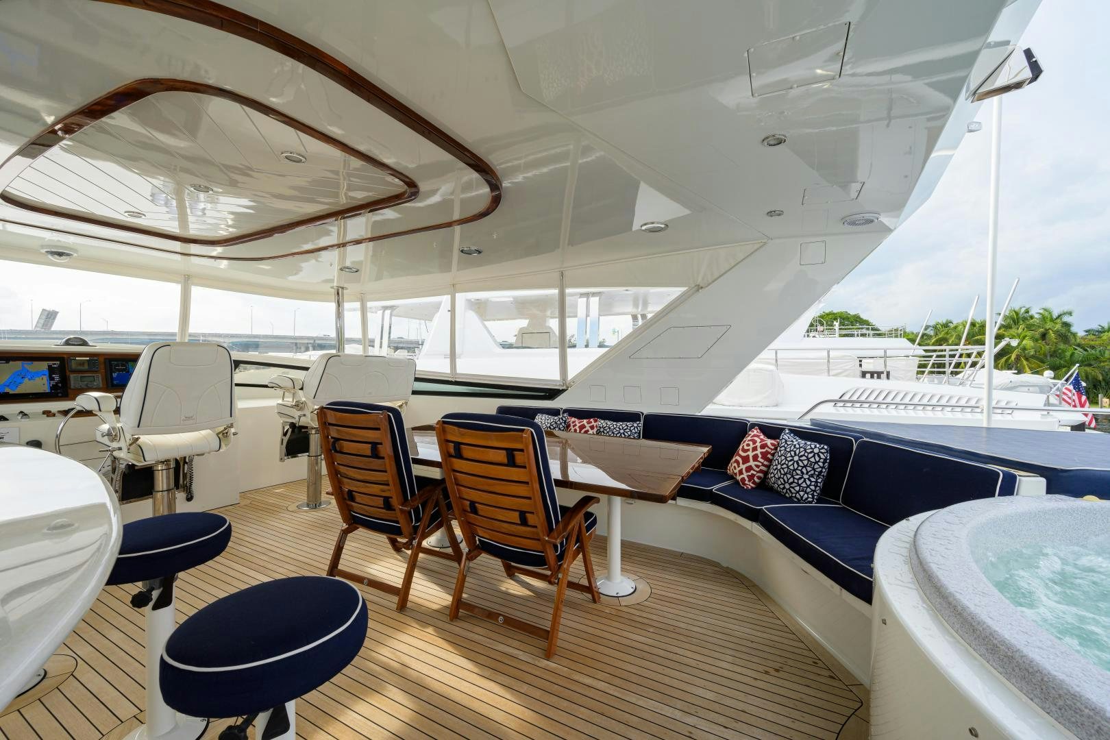 a room with a large white boat and chairs aboard SUPERSTAR Yacht for Sale