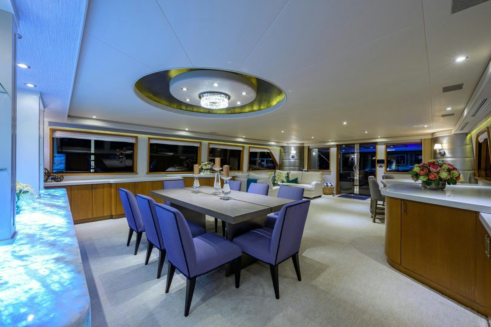 a large room with a table and chairs aboard SUPERSTAR Yacht for Sale
