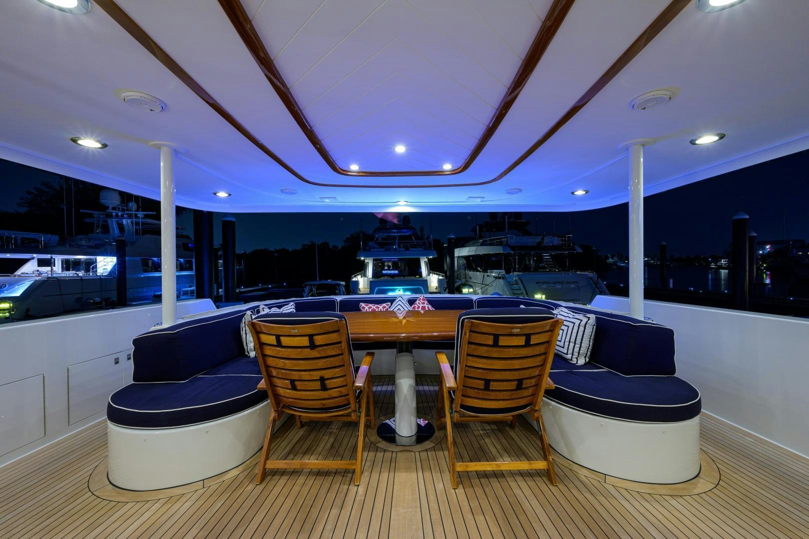 a pool table and chairs in a room with a table and chairs aboard SUPERSTAR Yacht for Sale