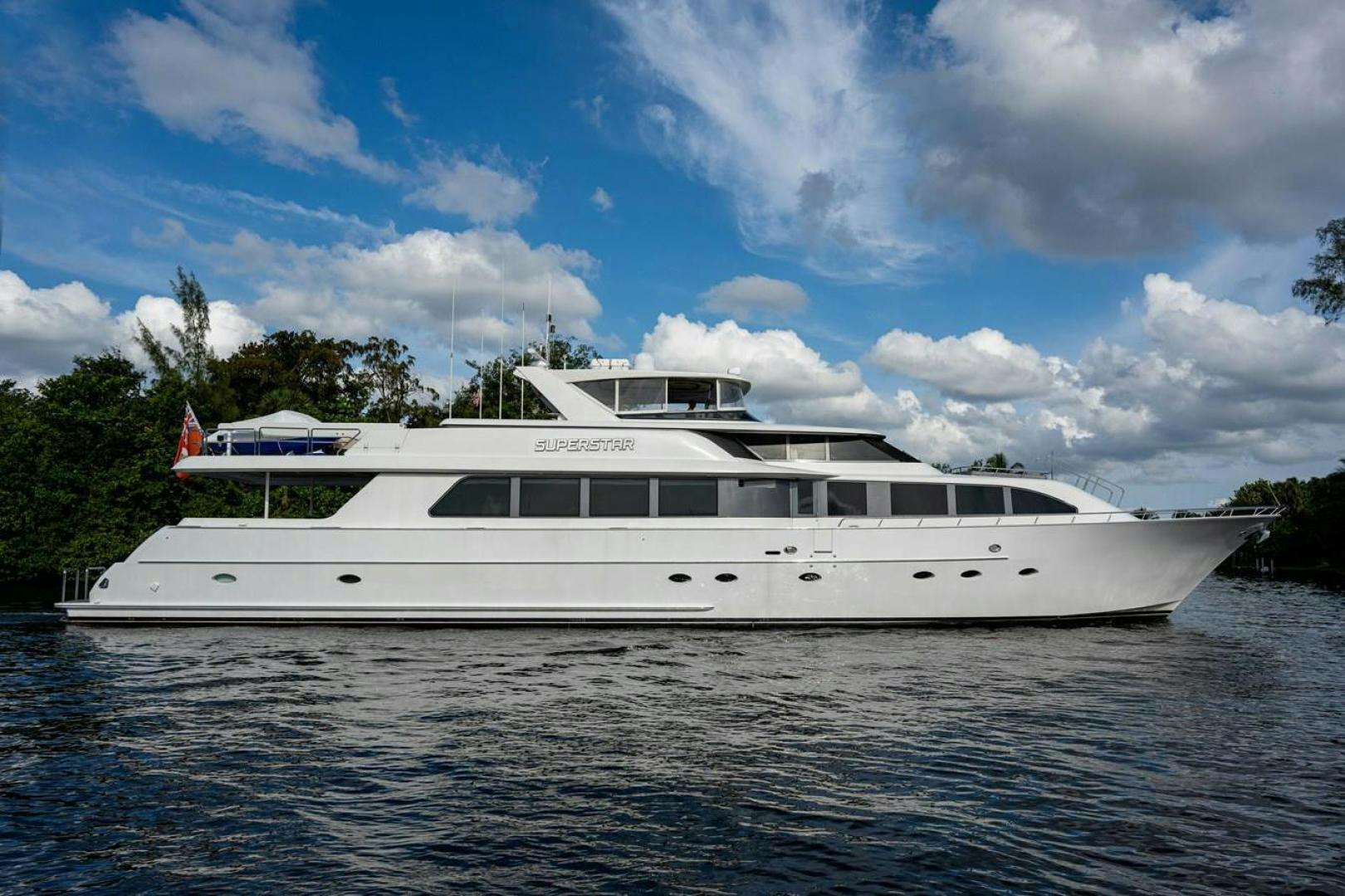 a white boat on water aboard SUPERSTAR Yacht for Sale