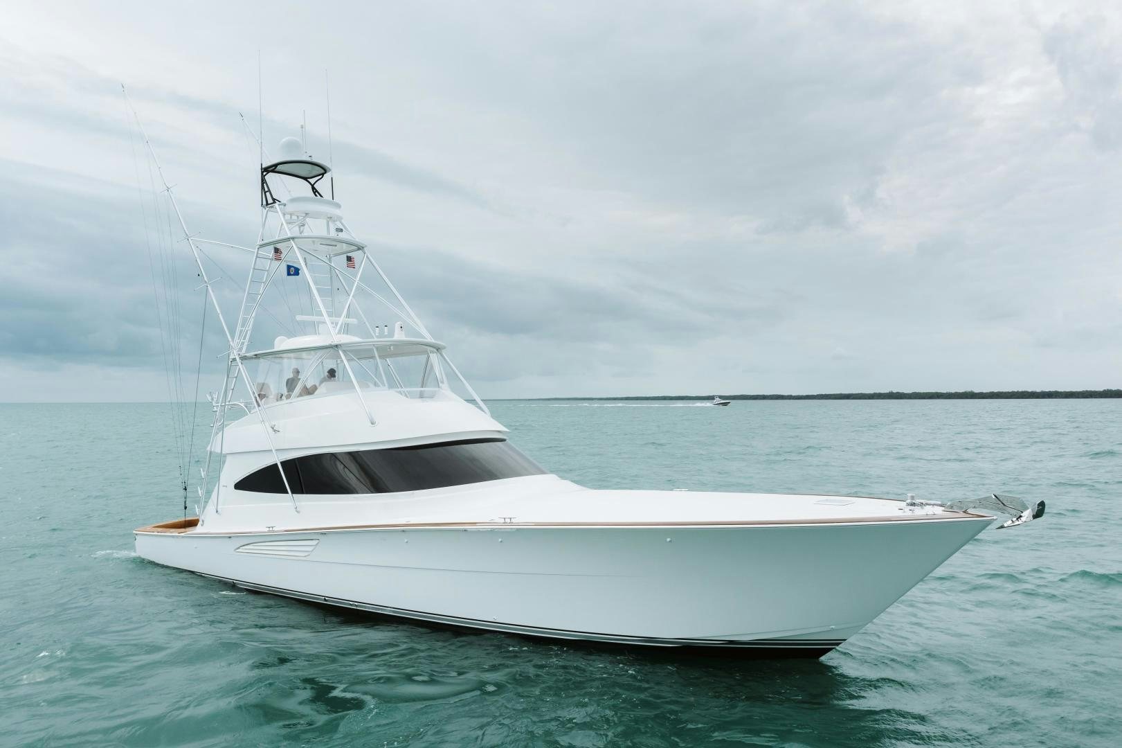 a white boat in the water aboard HEAVY ACTION Yacht for Sale