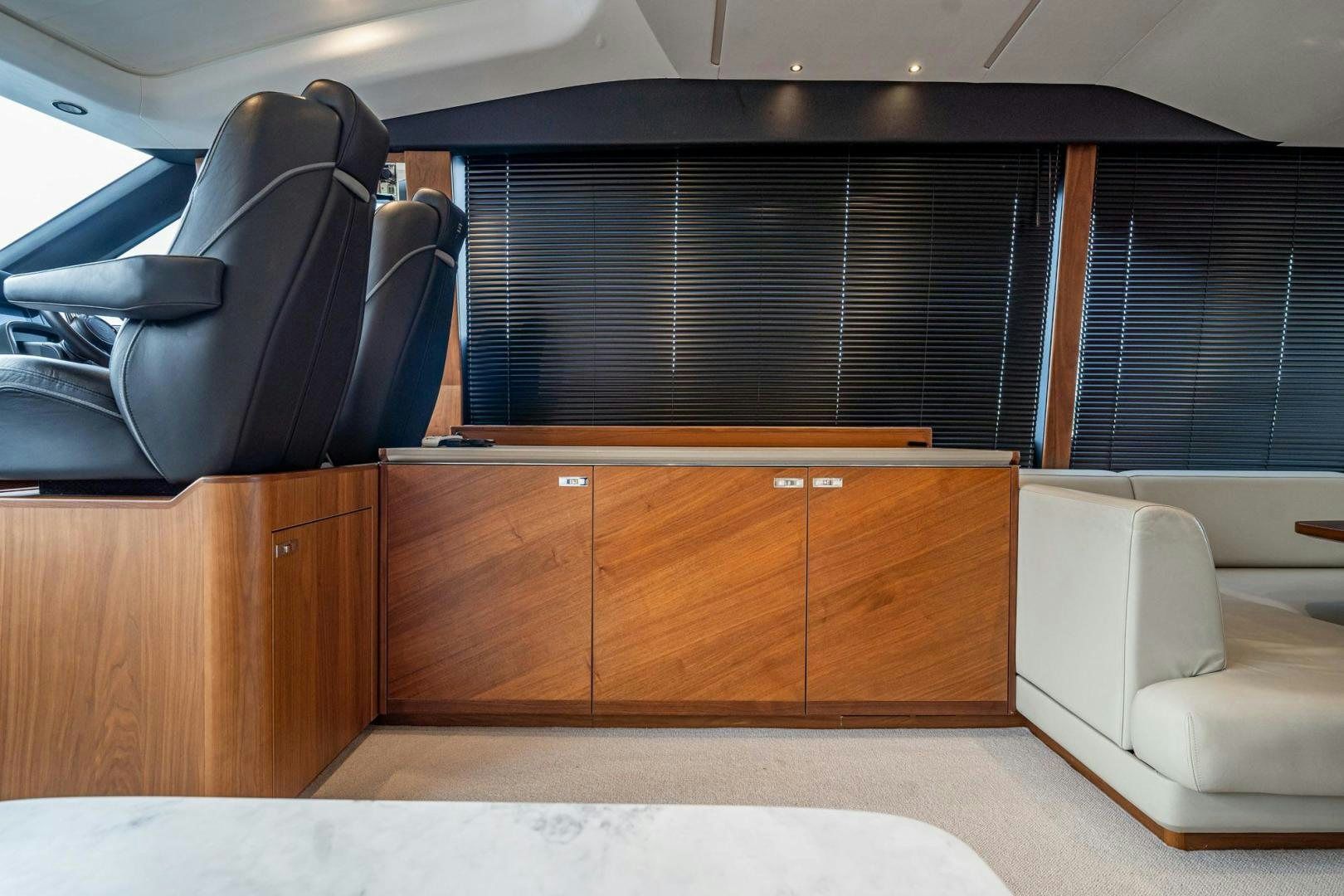 a room with a couch and a chair aboard COCOON Yacht for Sale