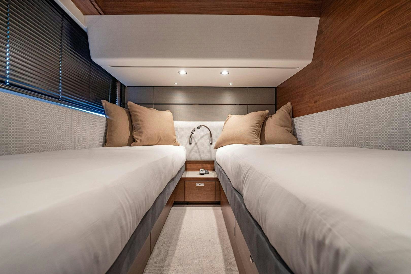 a room with two beds aboard COCOON Yacht for Sale